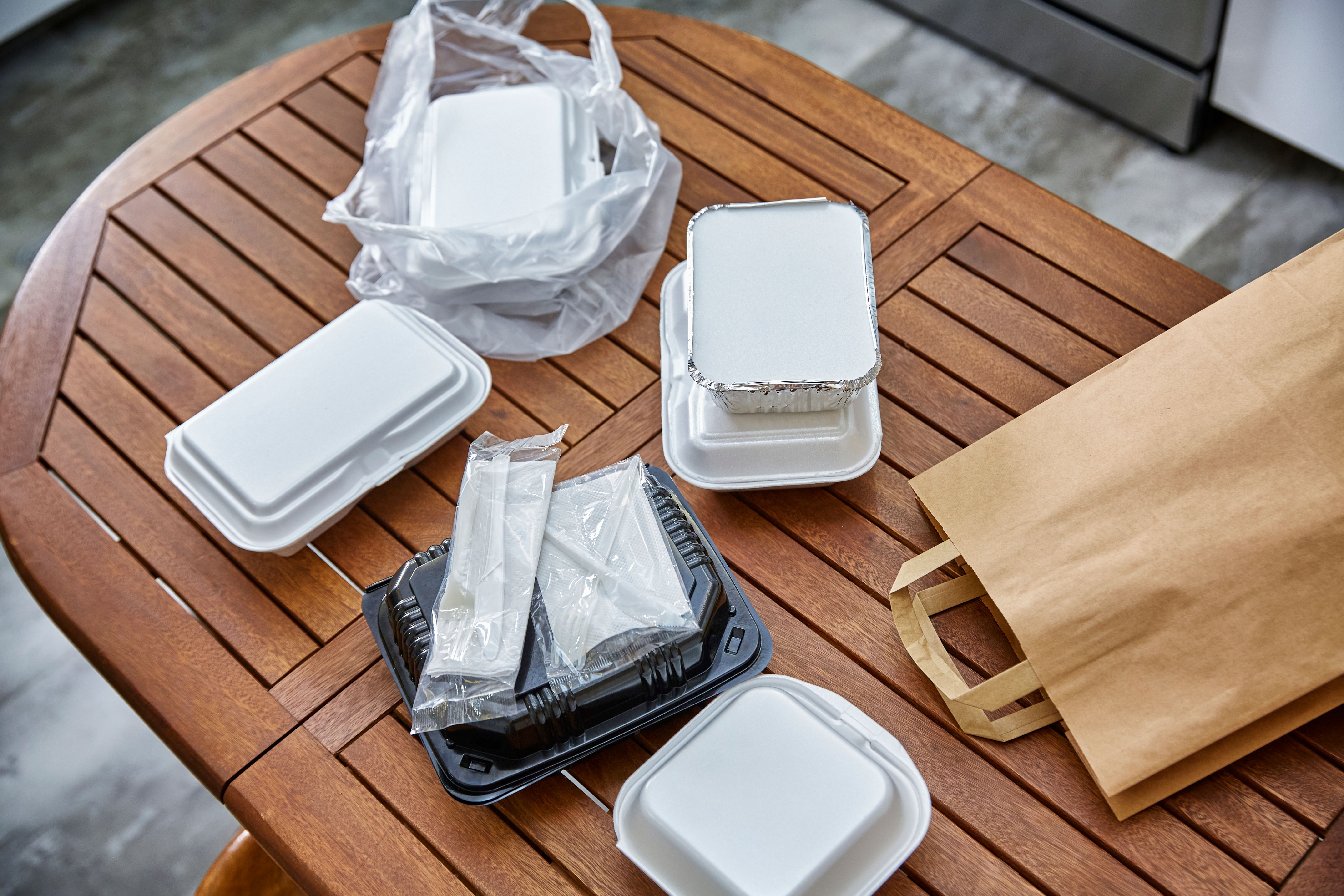 Just delivered take out food on the table at the kitchen