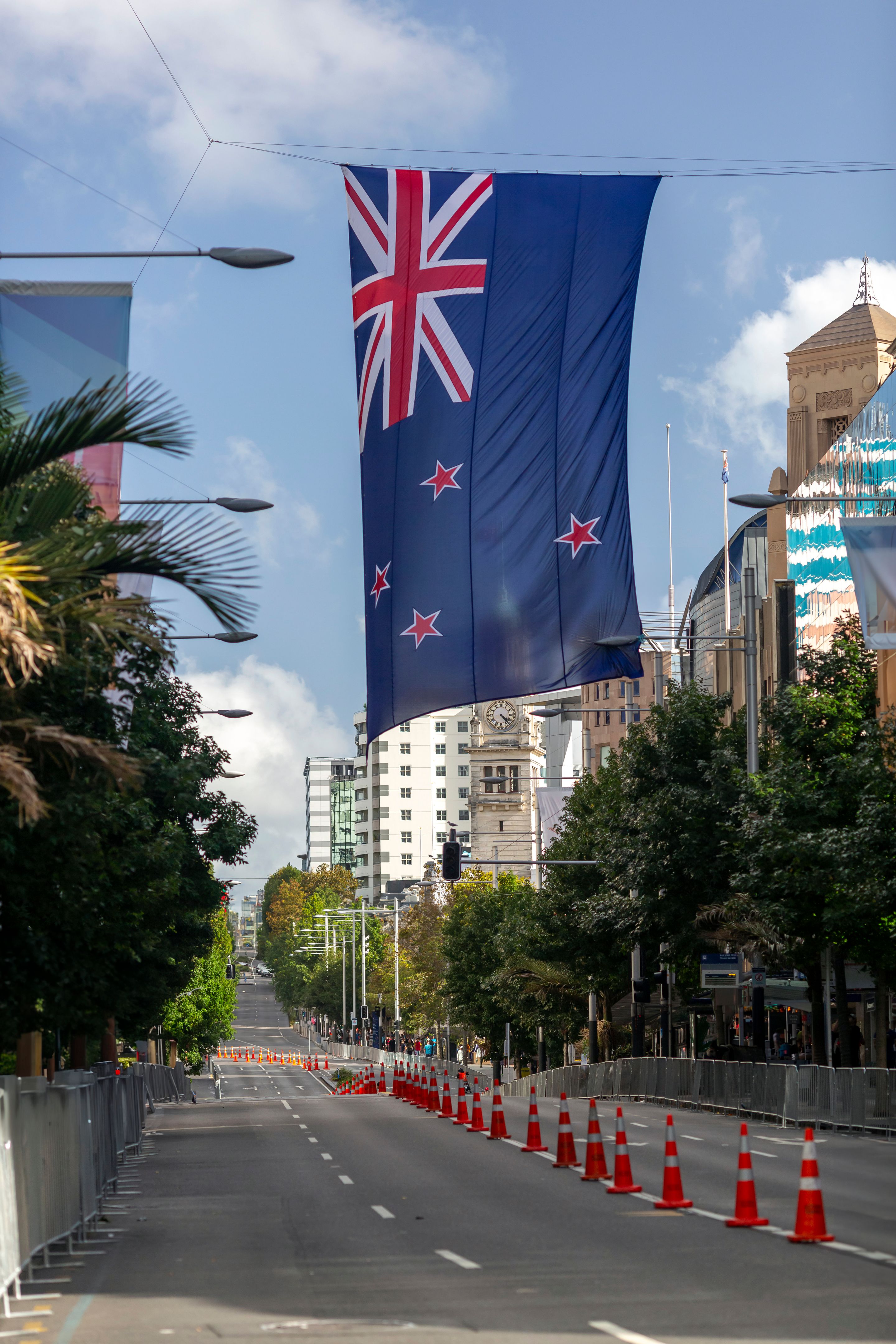 New Zealand flag hanging over Queen Street in Auckland, New Zealand