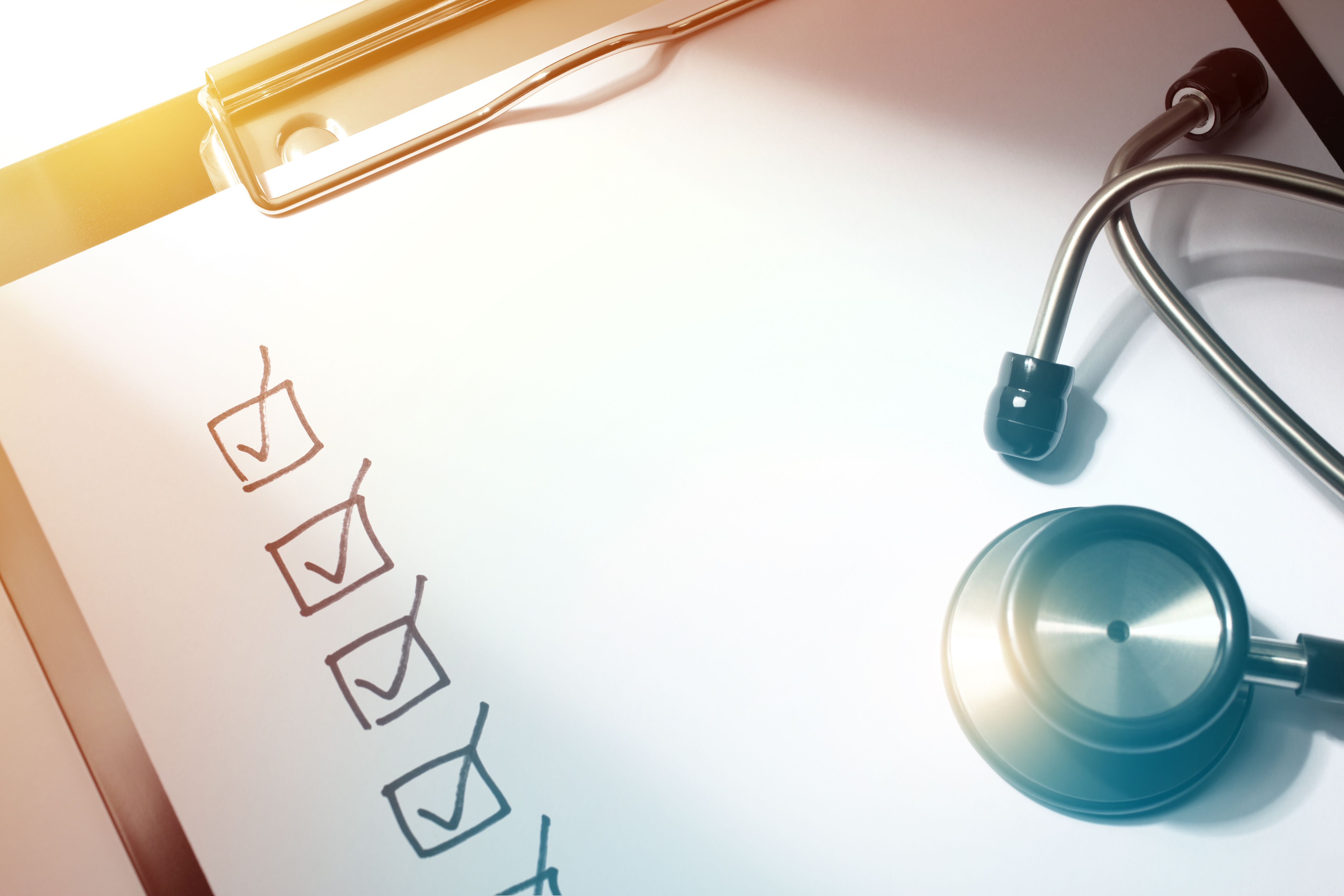 Questionnaire Concept Close-up of Checklist Drawing and Stethoscope on Doctors Medical Report Clipboard