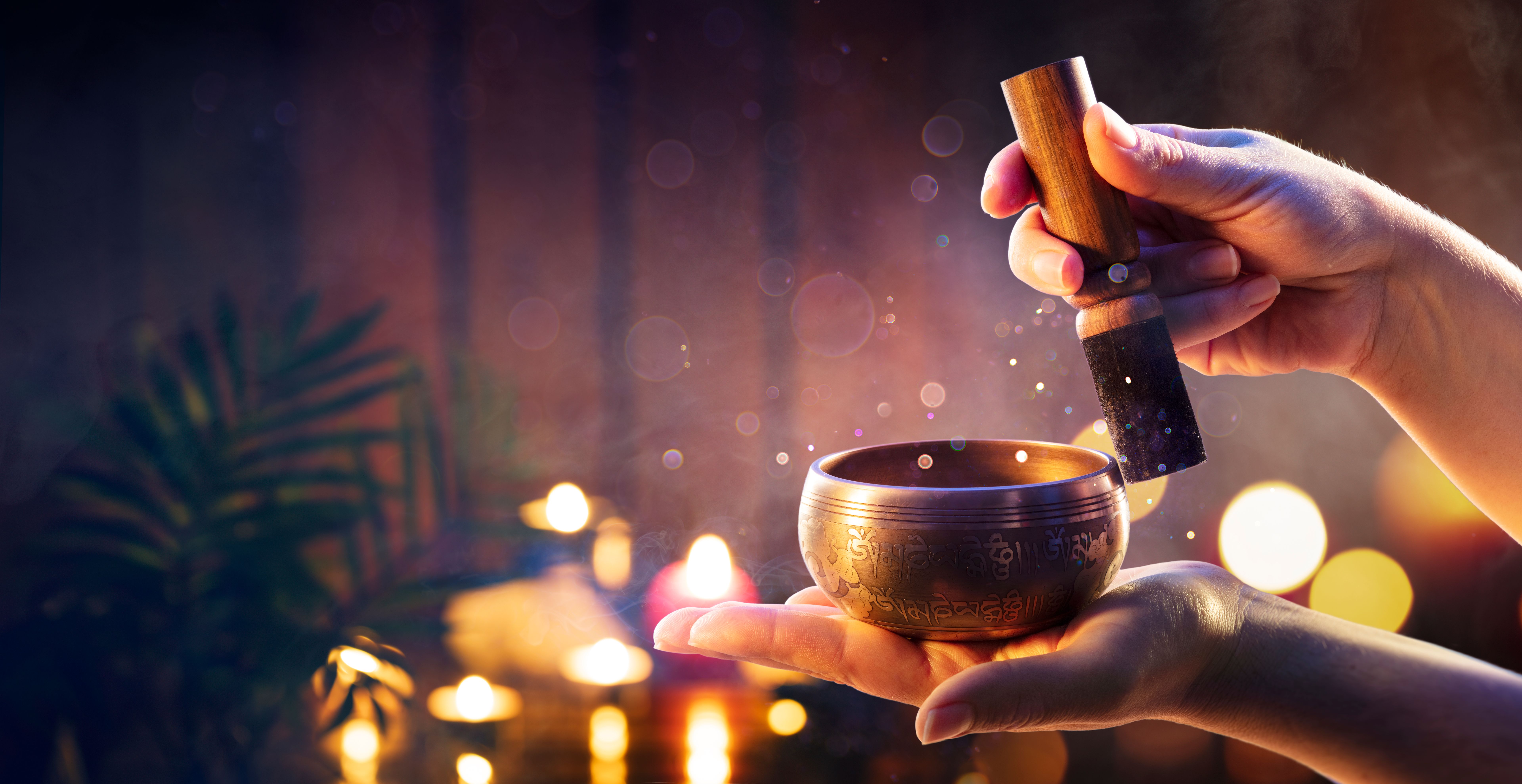 Woman Hands Playing Tibetan Singing Bowl - Translation of mantras : transform your impure body, speech, and mind into the pure exalted body, speech, and mind of a Buddha