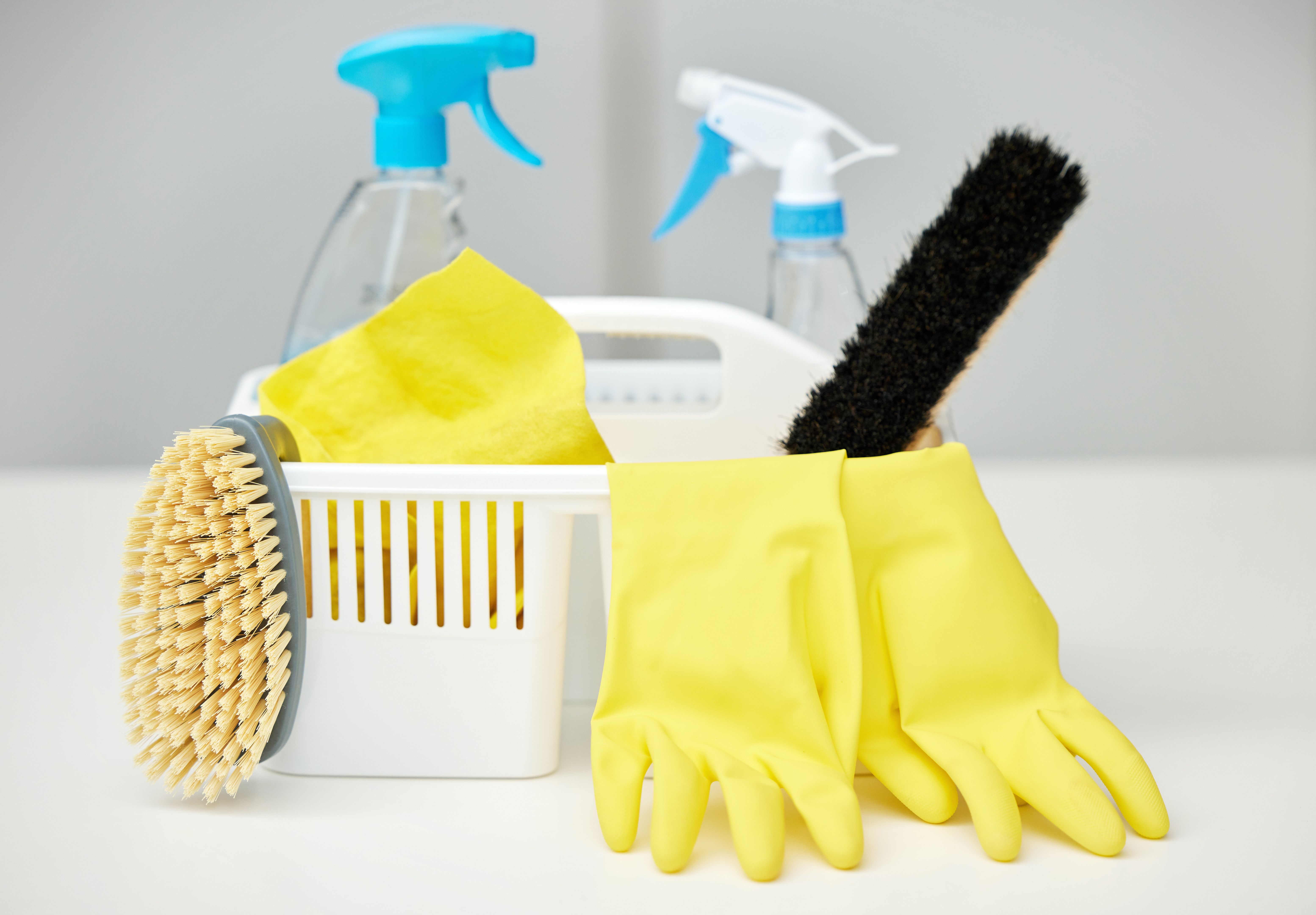 Shot of cleaning supplies in a basket on a table