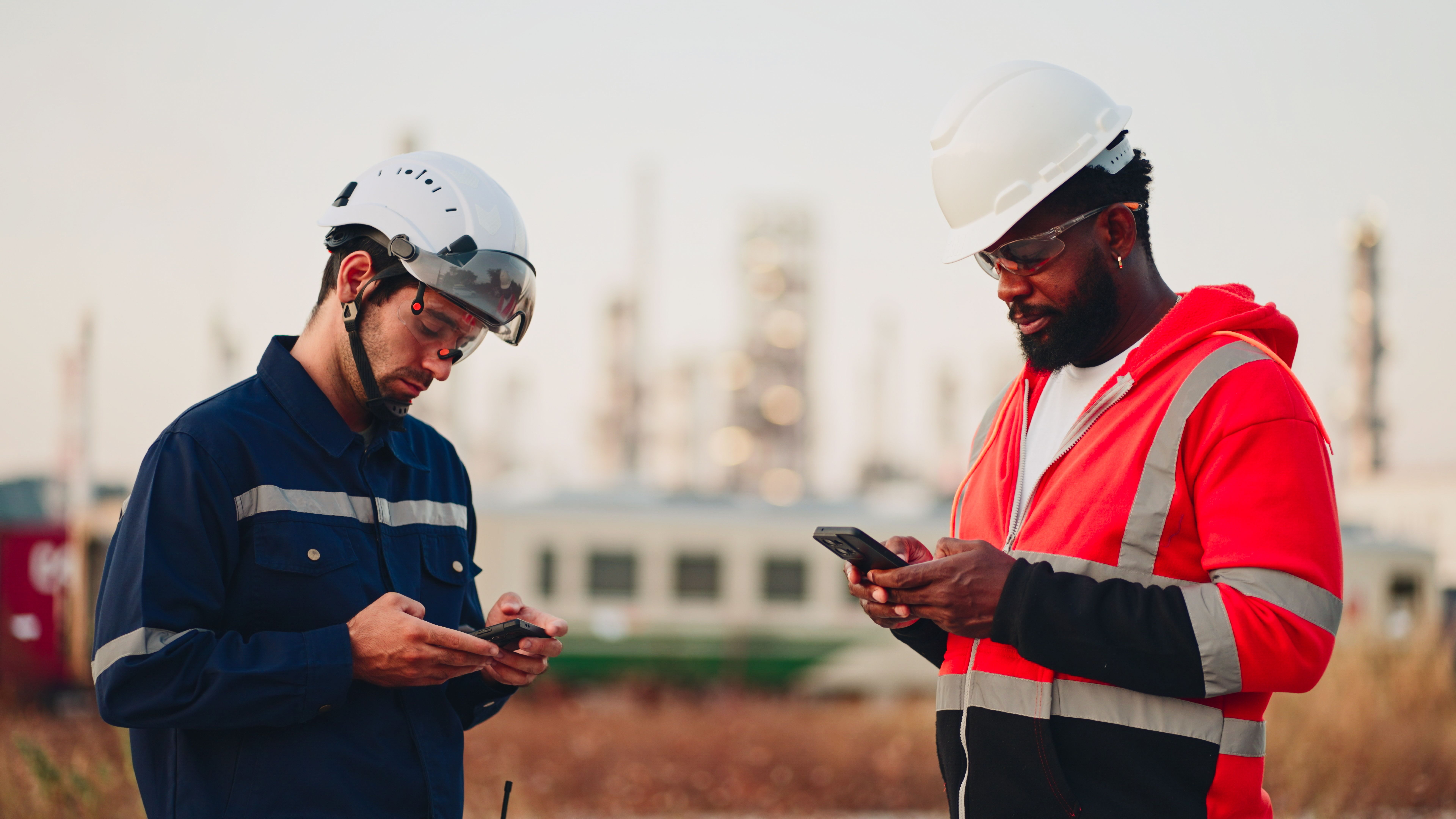 Engineer working to check safety quality control of oil and gas plant at sunset.