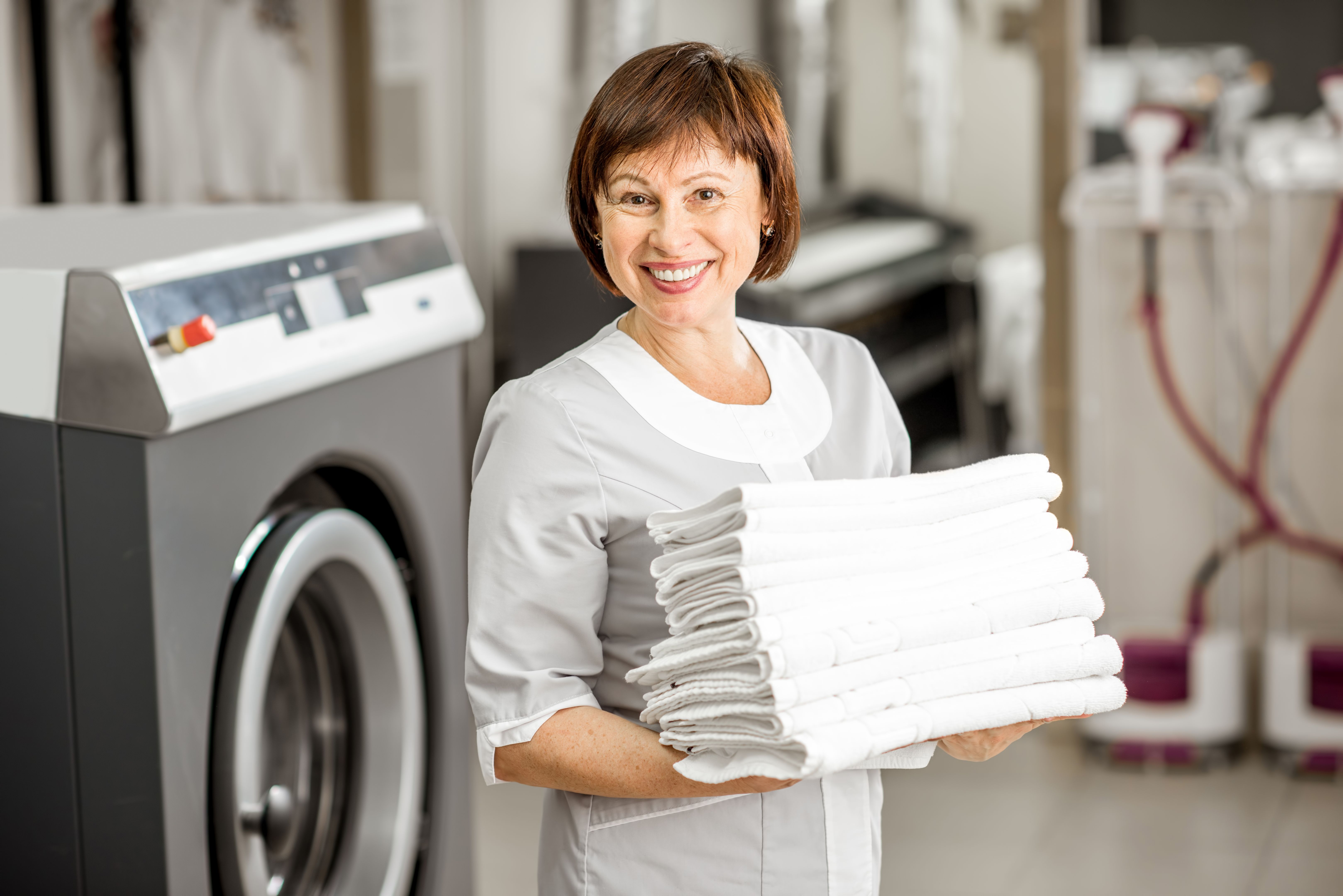 laundromat attendant helping
