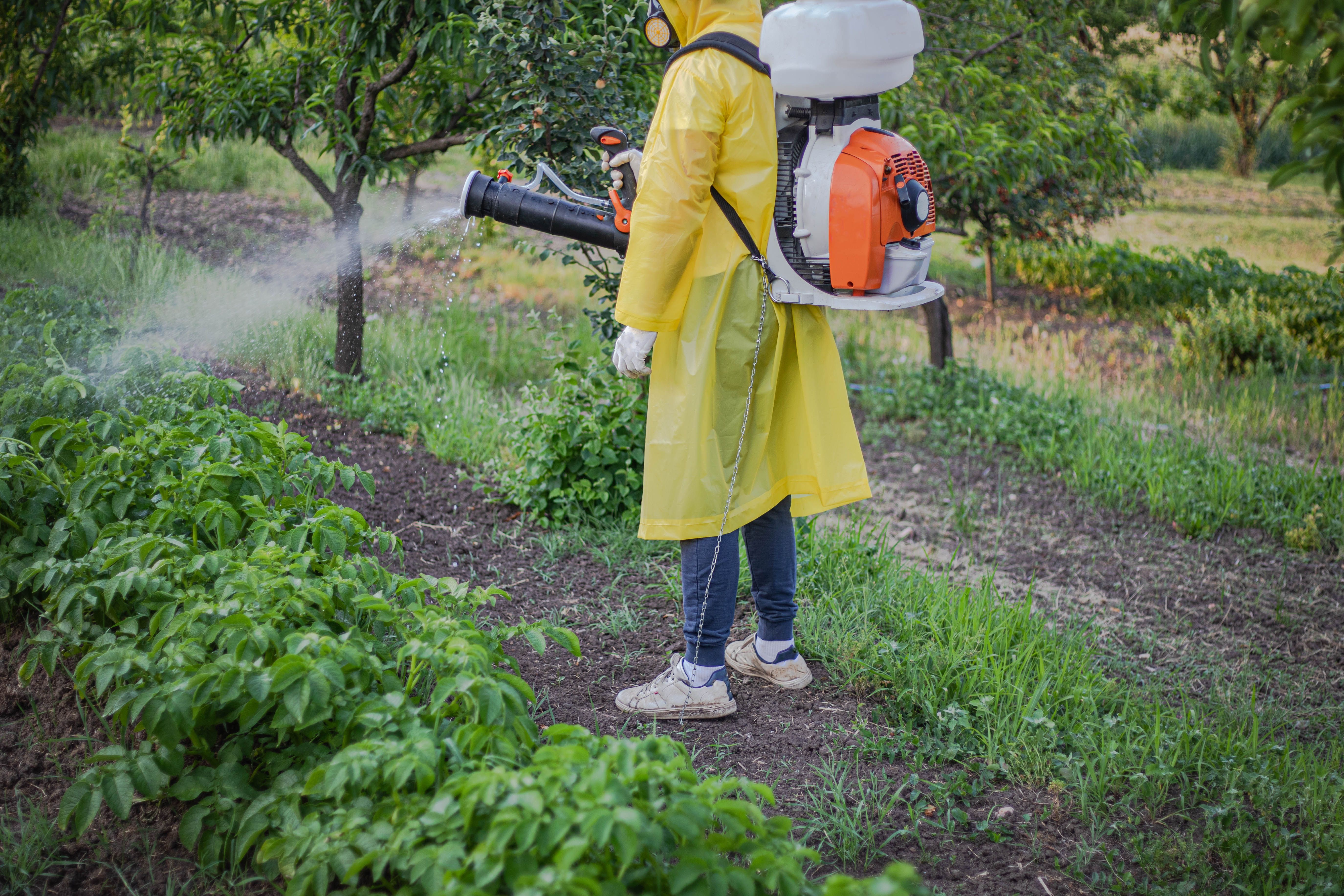 farmer using herbicide