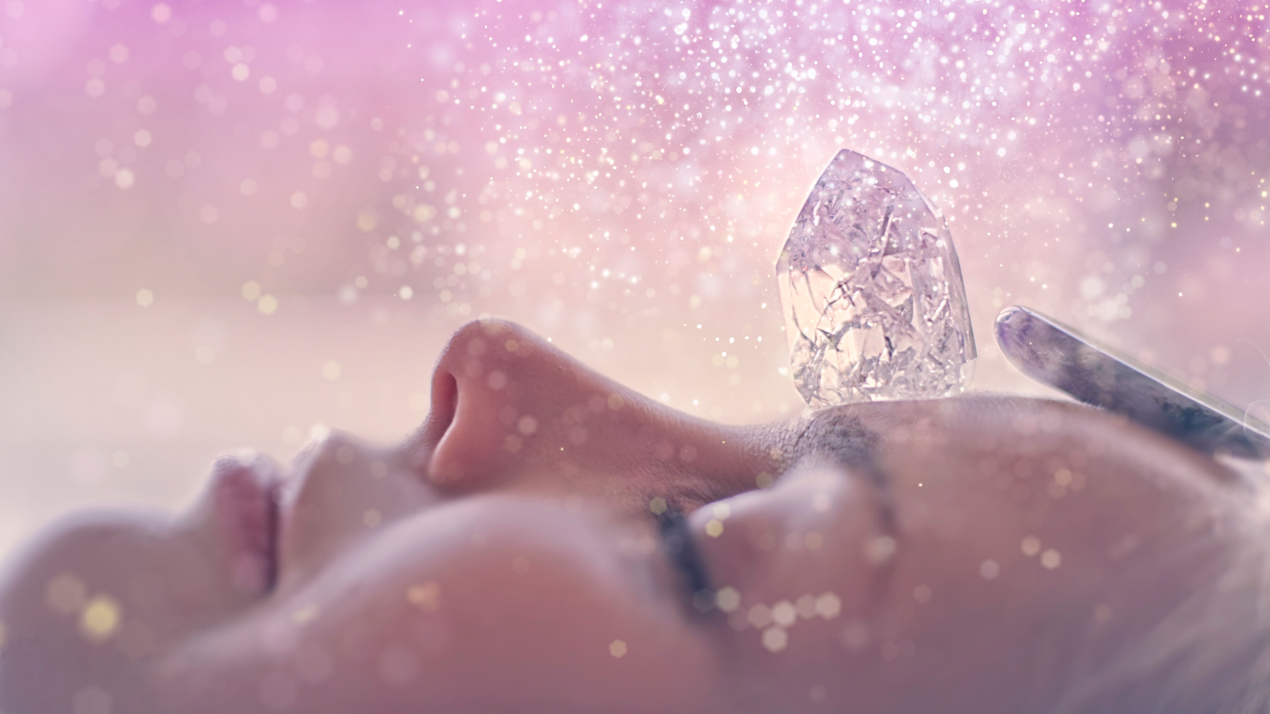 Woman's head with a healing crystal.