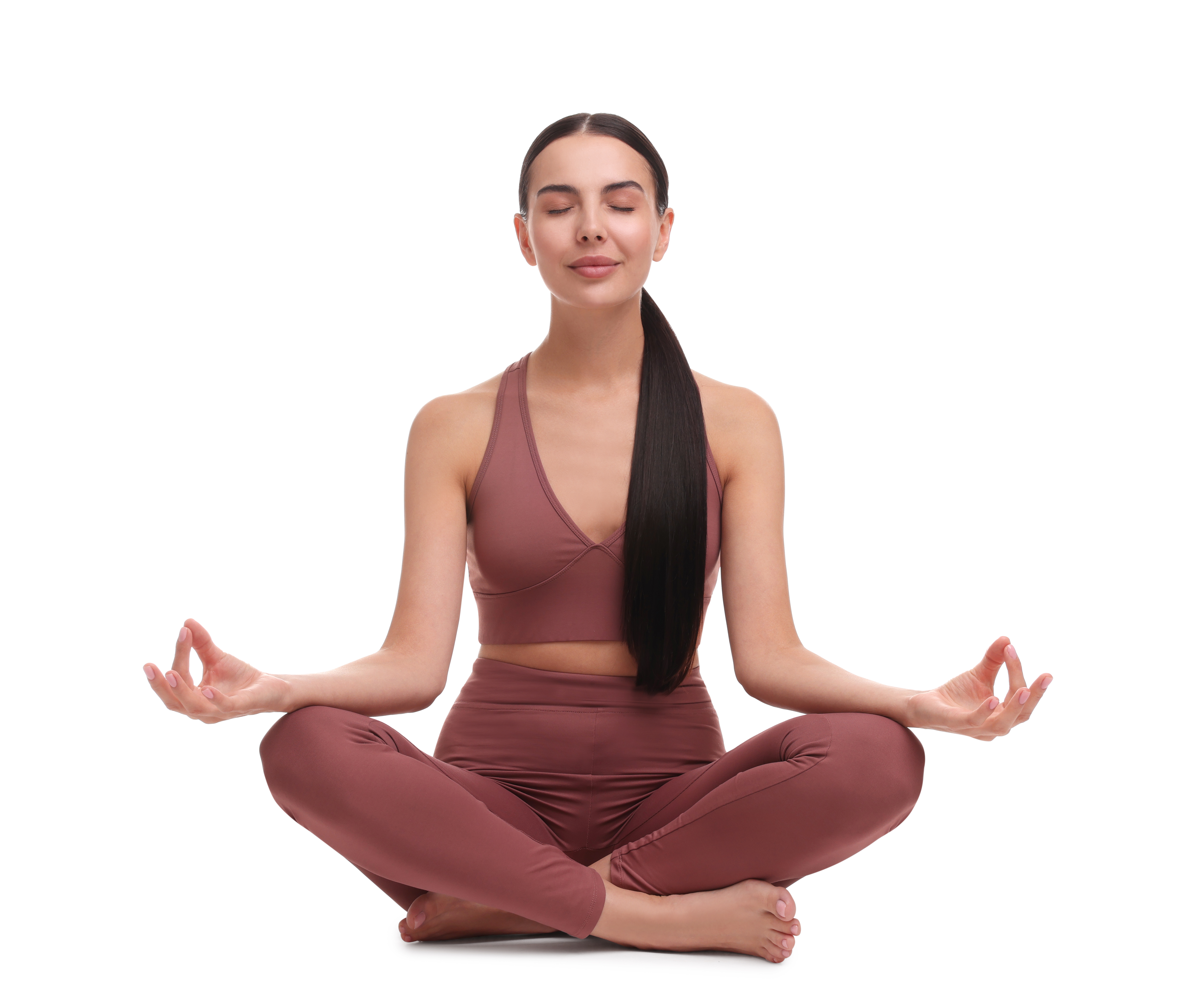 Beautiful young woman practicing yoga on white background. Lotus pose