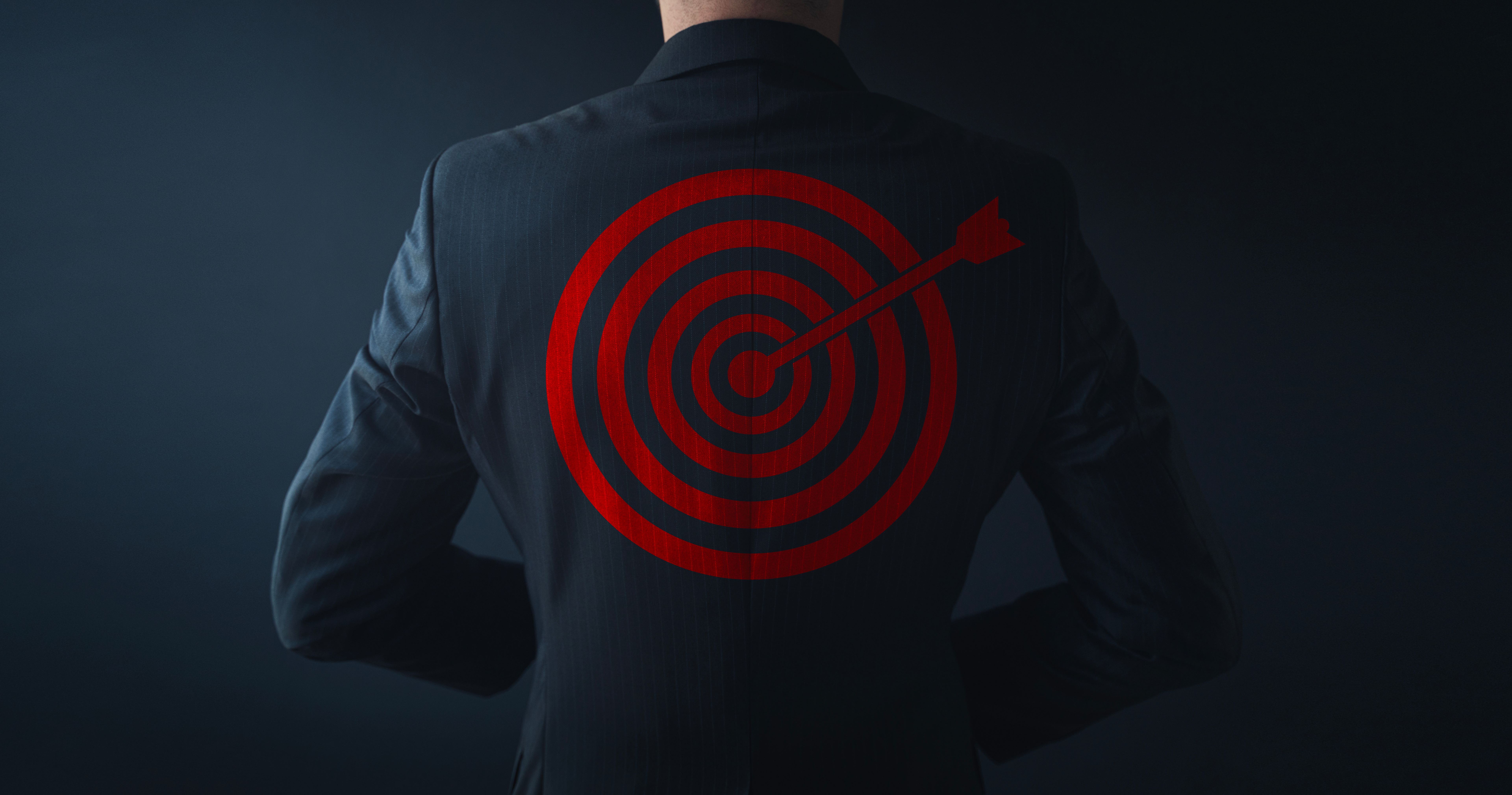 Businessman Standing With A Target On His Back