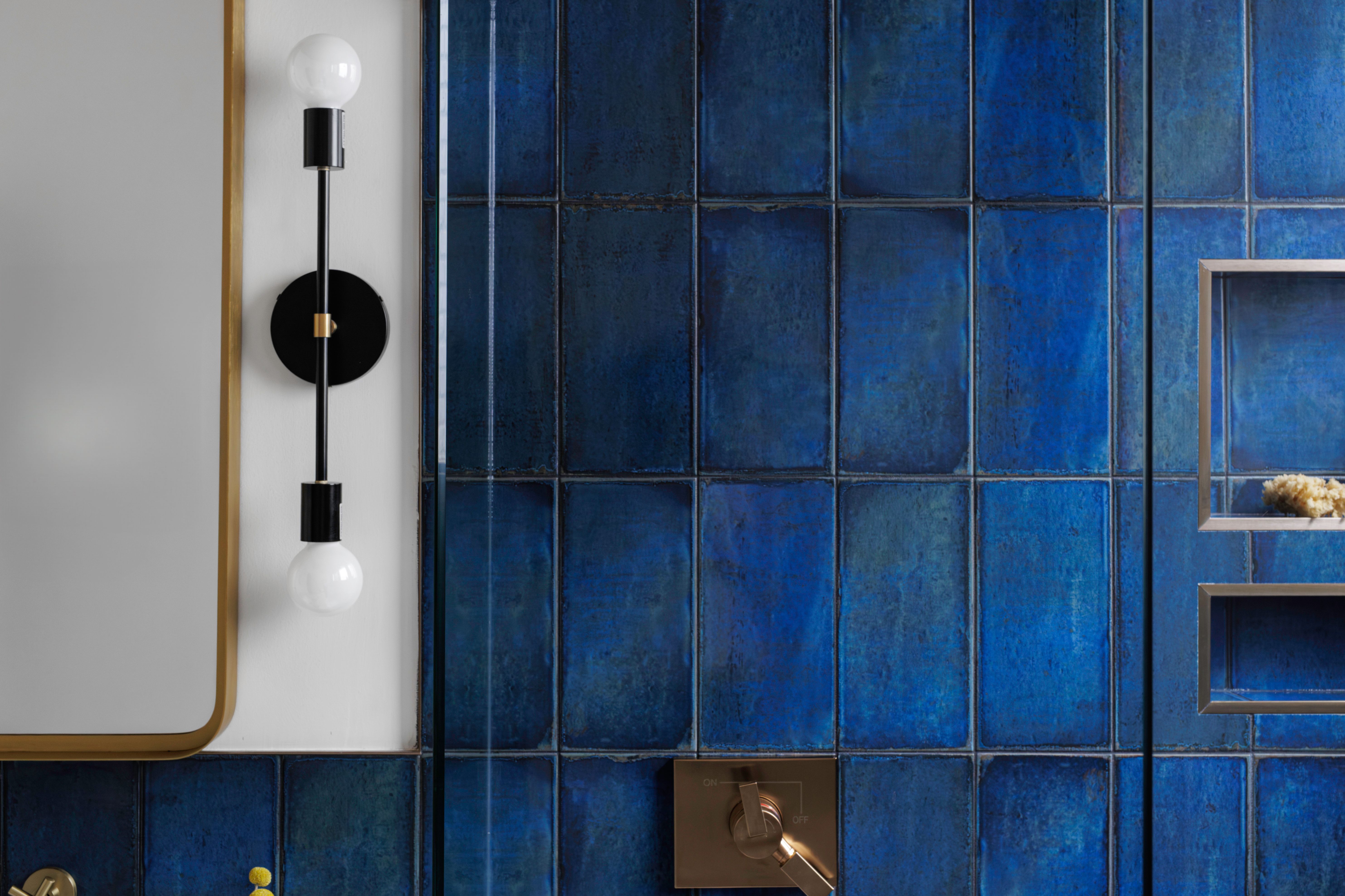 Blue Tiled Bathroom Wall With Modern Lighting Fixture Blue Tiled Bathroom Wall With Modern Lighting Fixture