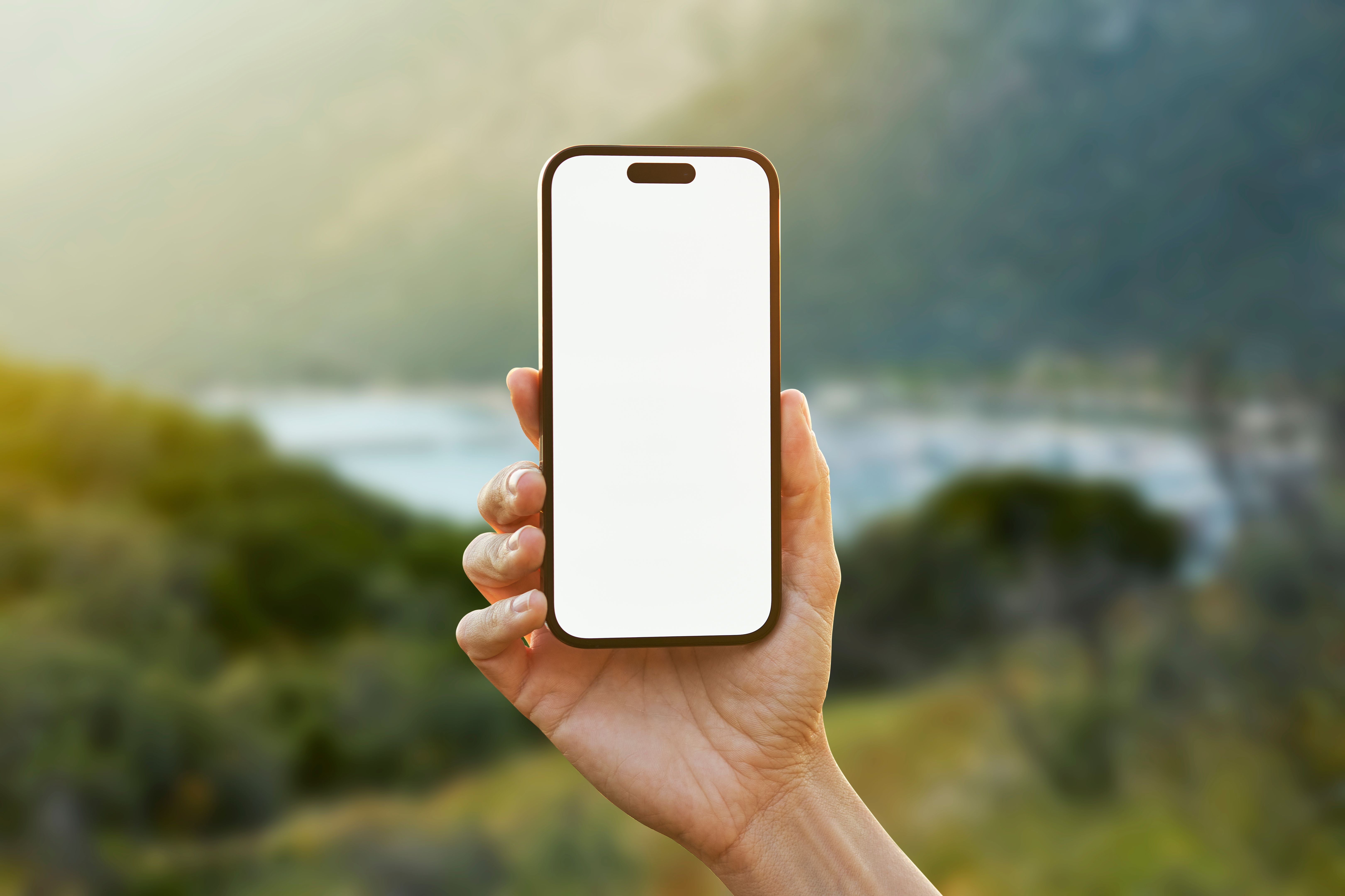 Young woman showing mobile phone blank white screen on Marina Background