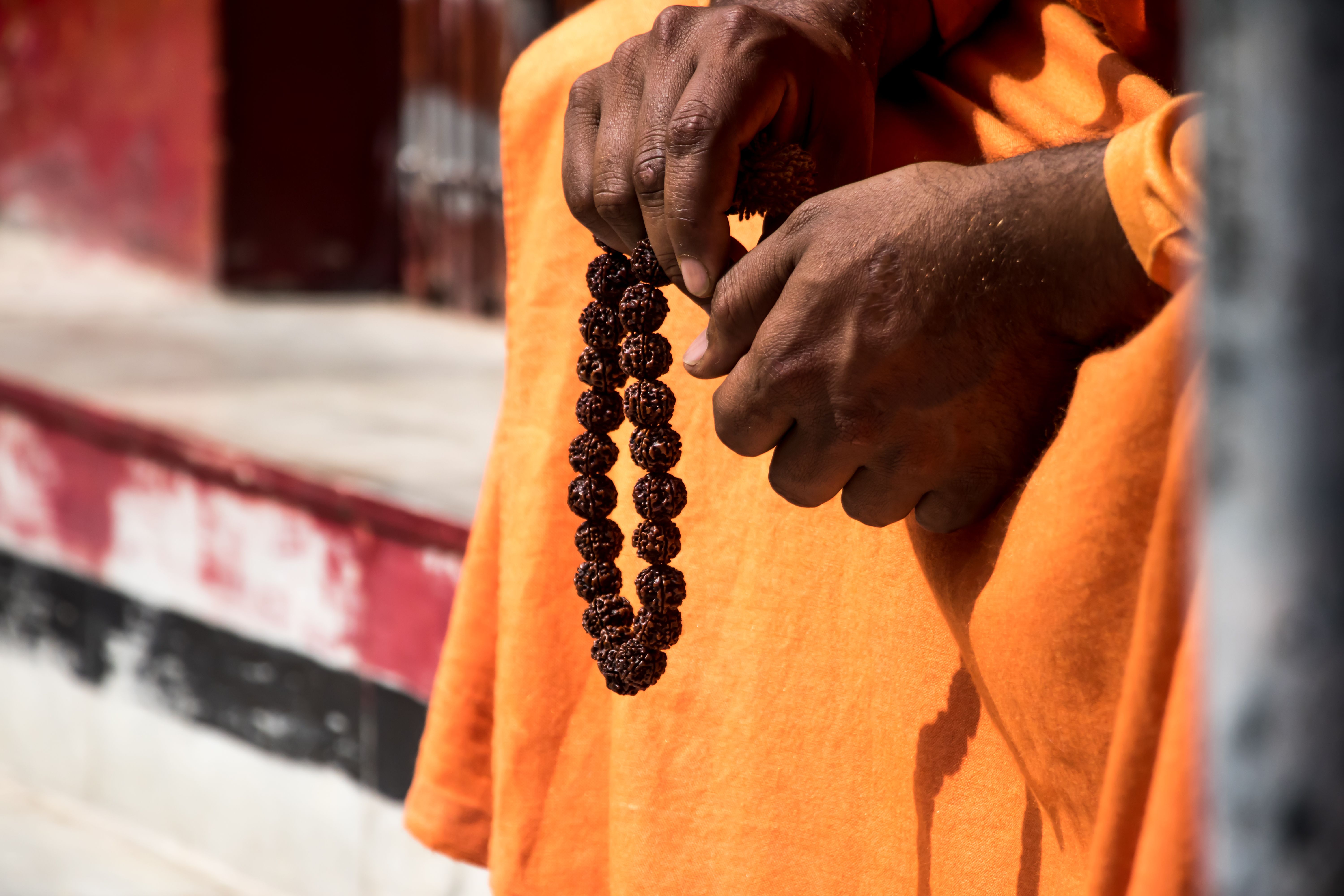 Image of a sadhu sitting in a meditation pose with beads Image of a sadhu sitting in a meditation pose with beads