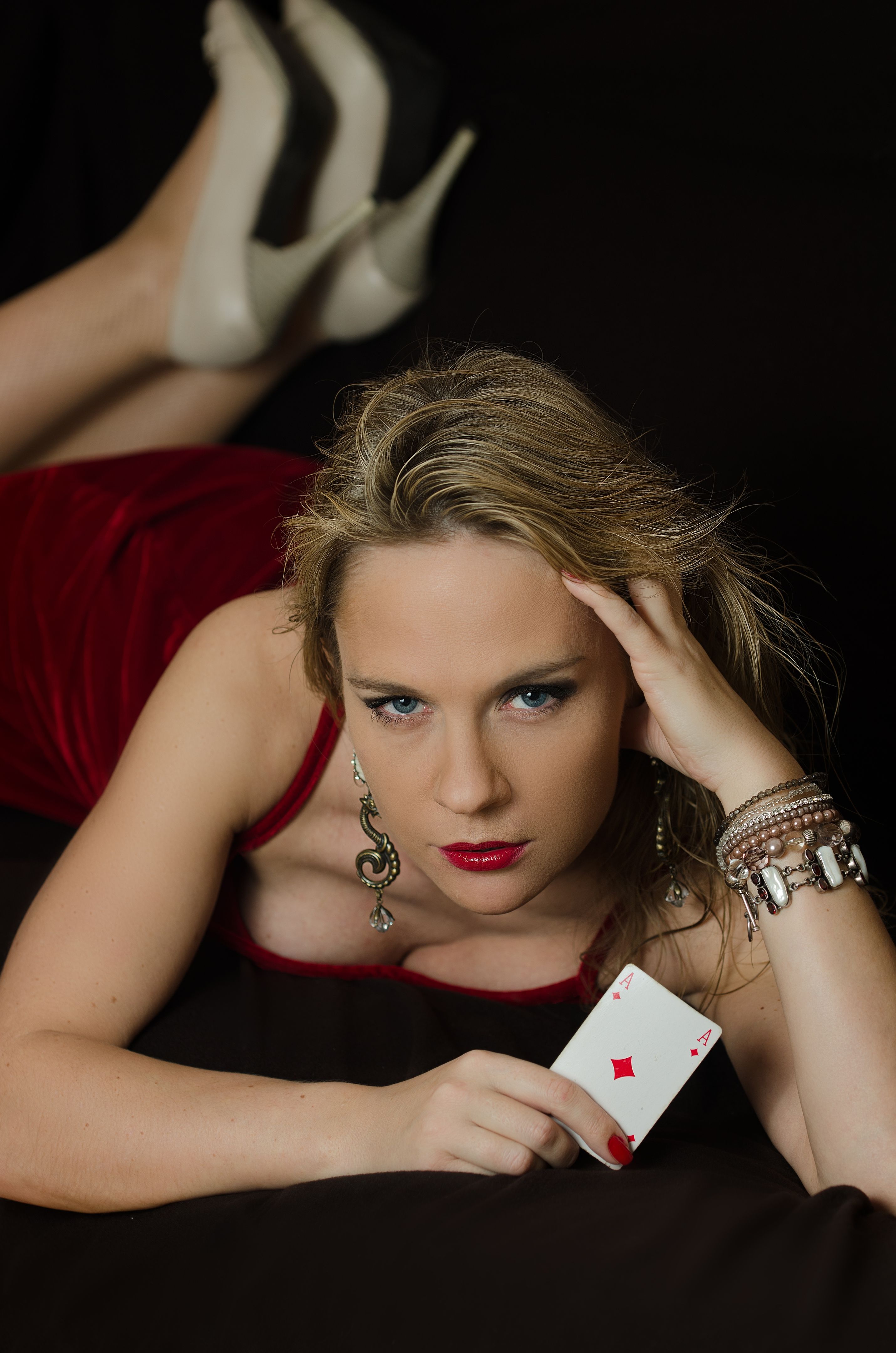 Woman in red with playing card
