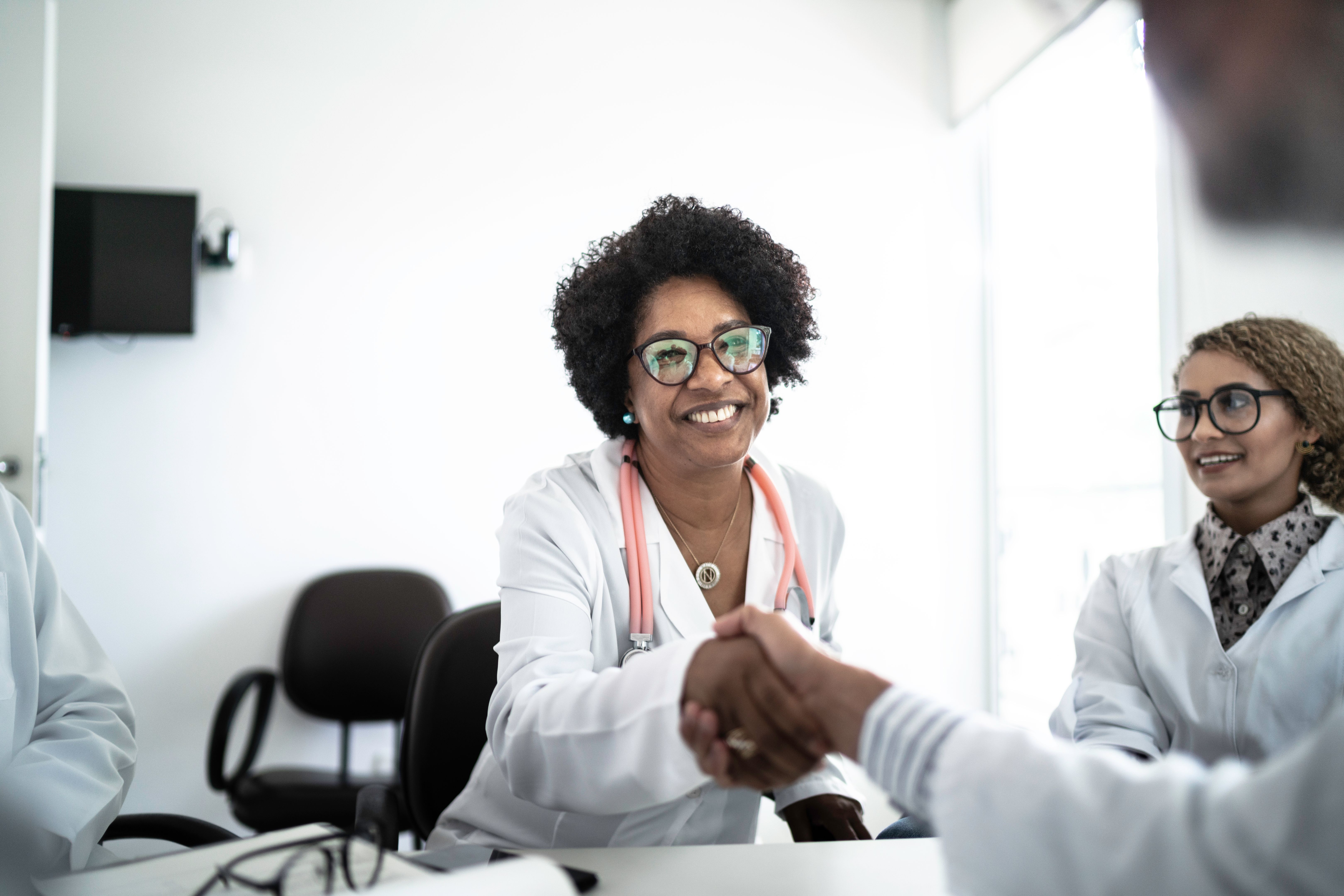 Doctors on a handshake during conference / meeting