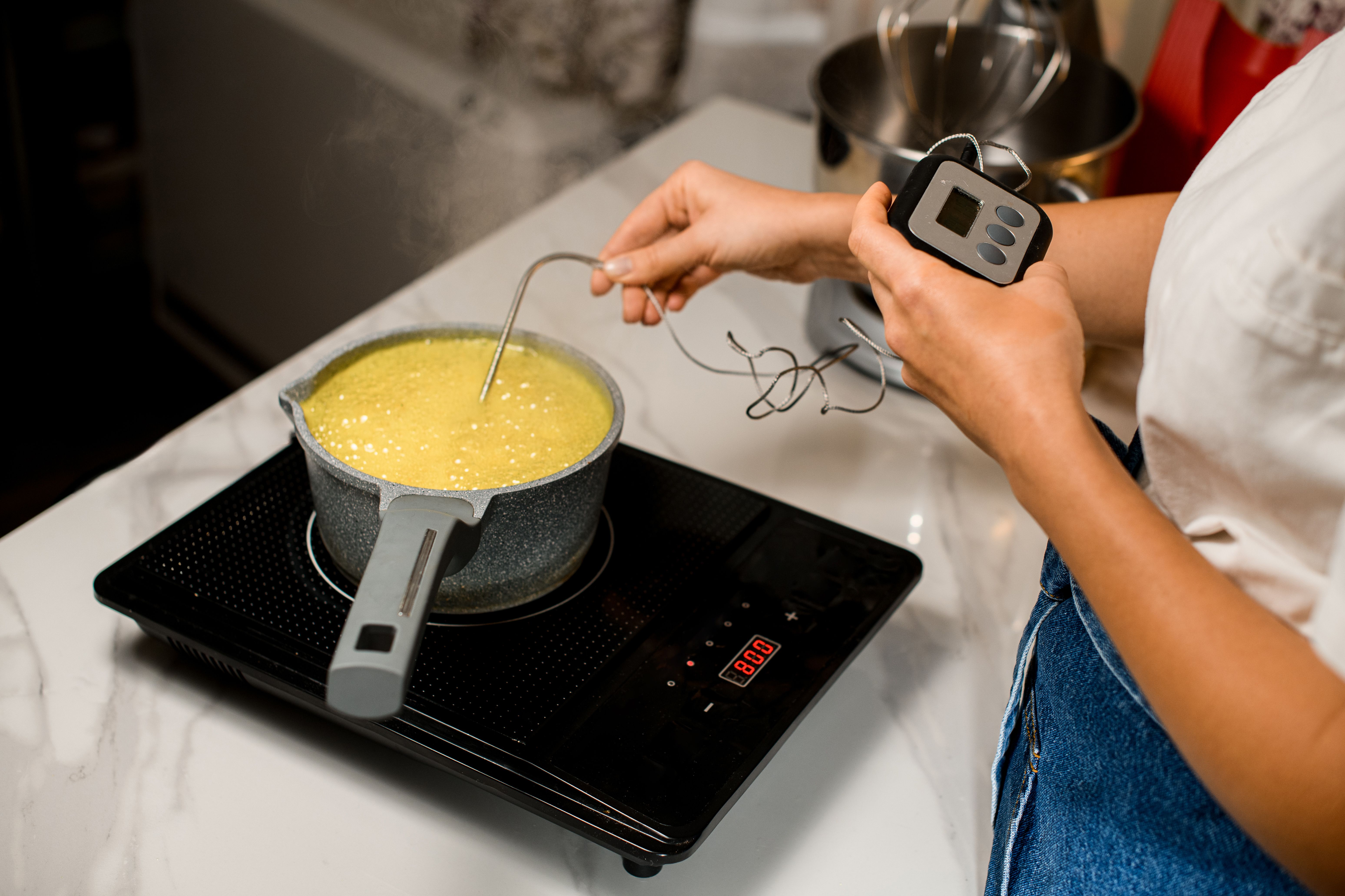 baker using thermometer