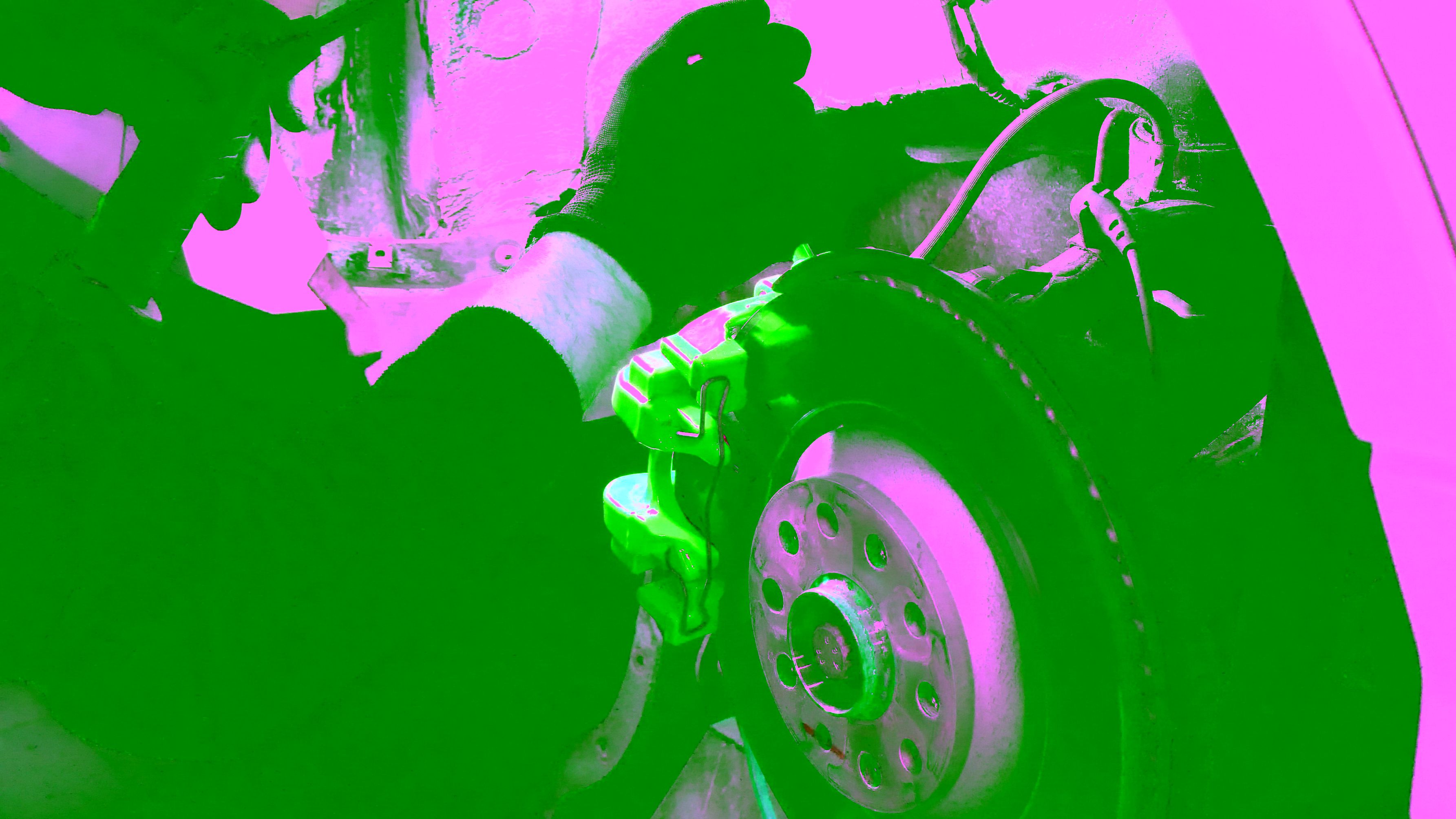 mechanic working brakes