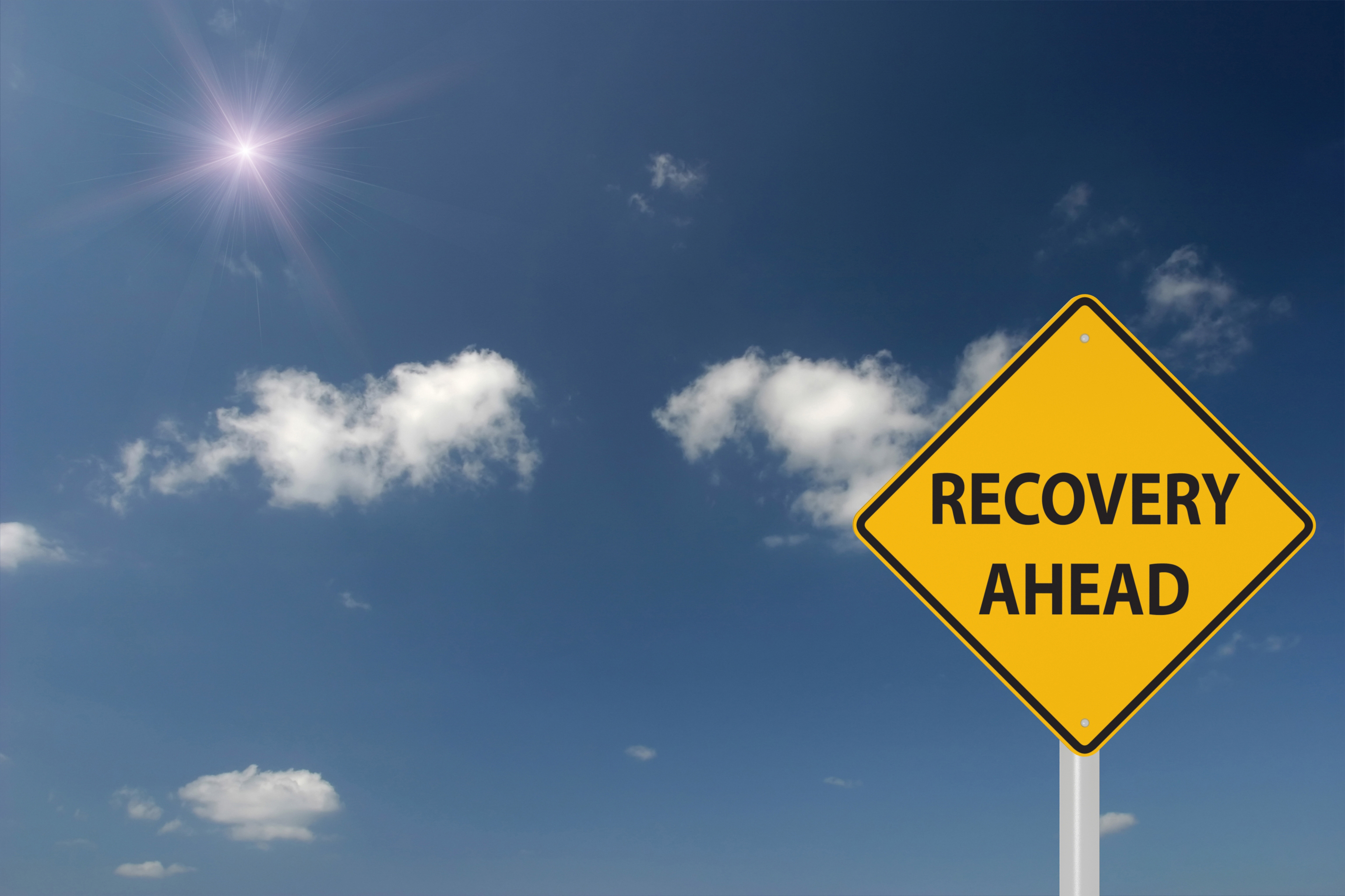 Recovery ahead warning sign concept Recovery ahead warning sign concept