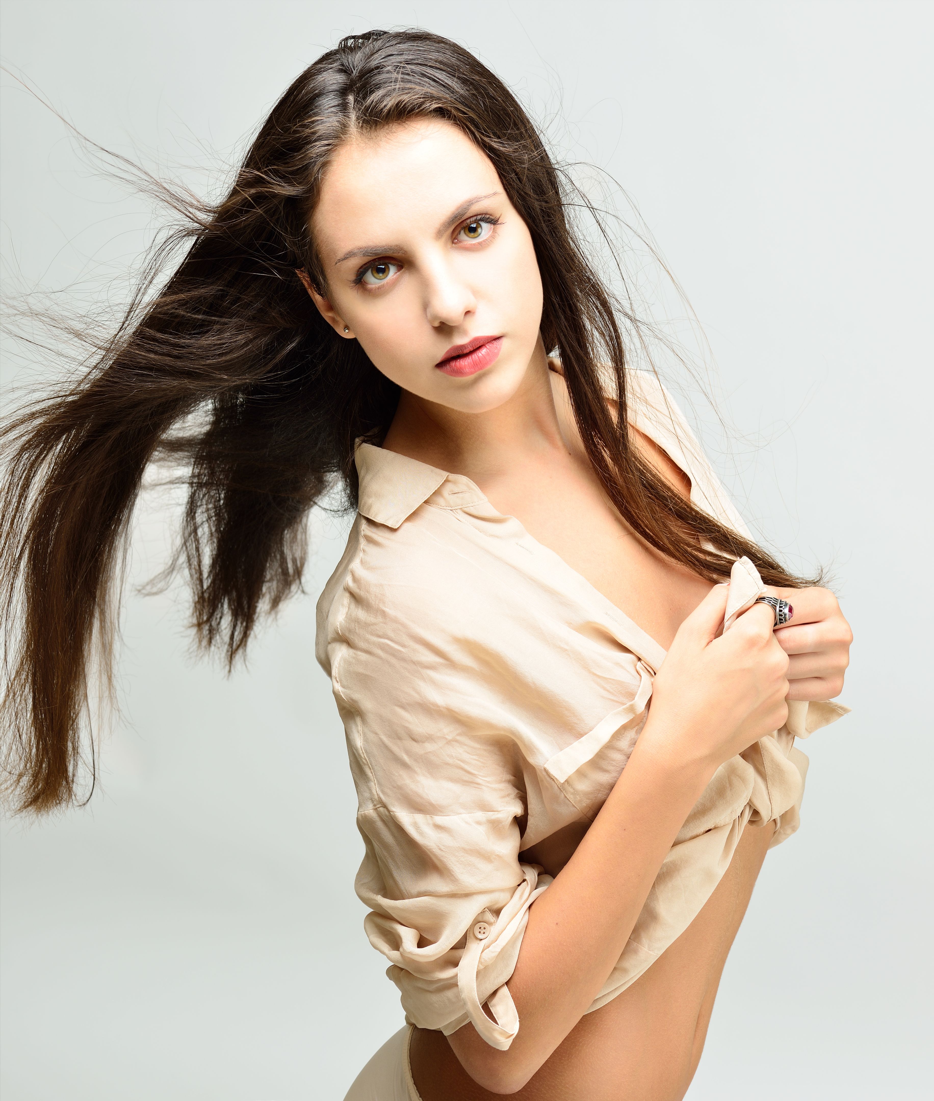 Beautiful  naked woman with long hair in light shirt