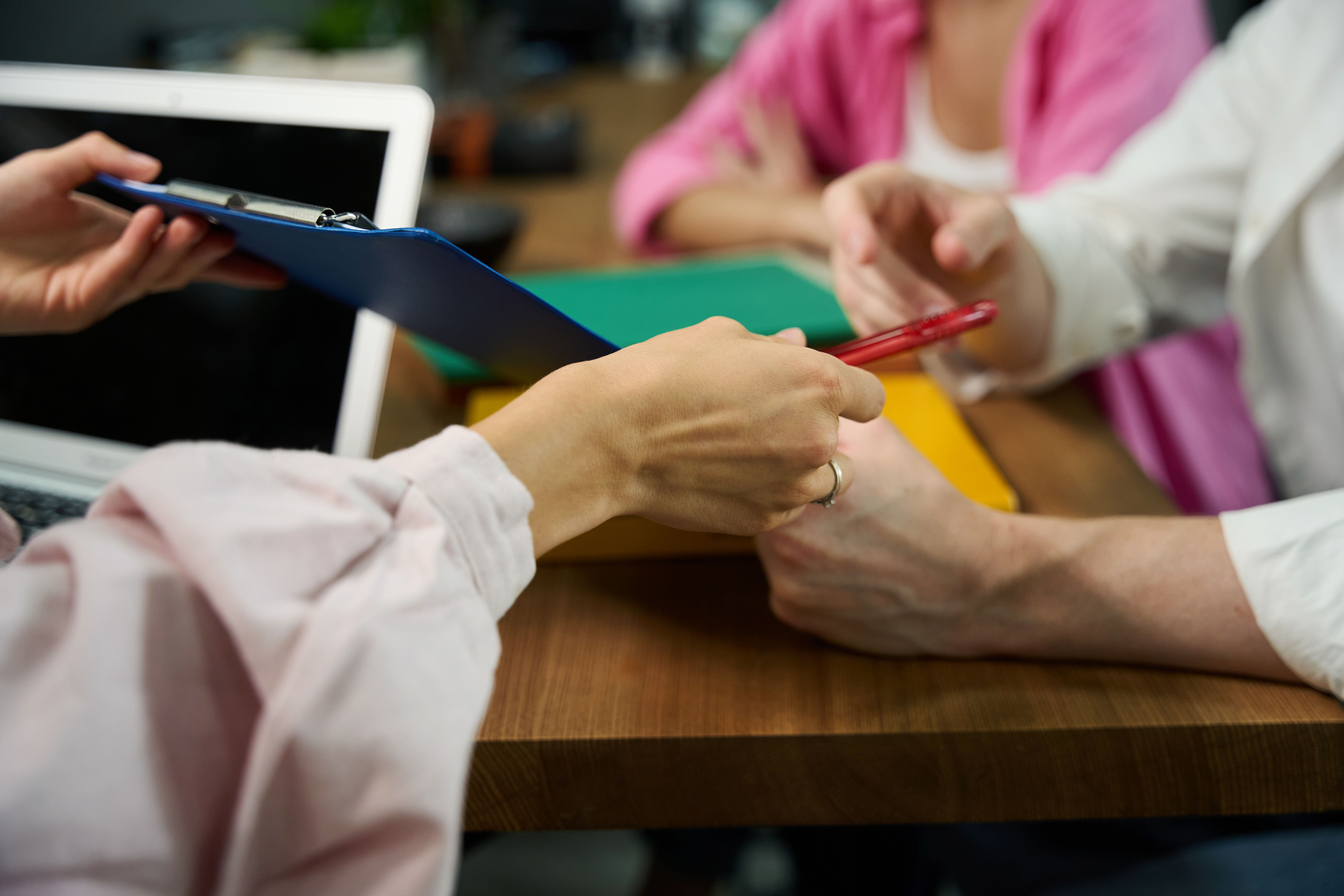 Manager and the buyer sign documents for ordering furniture