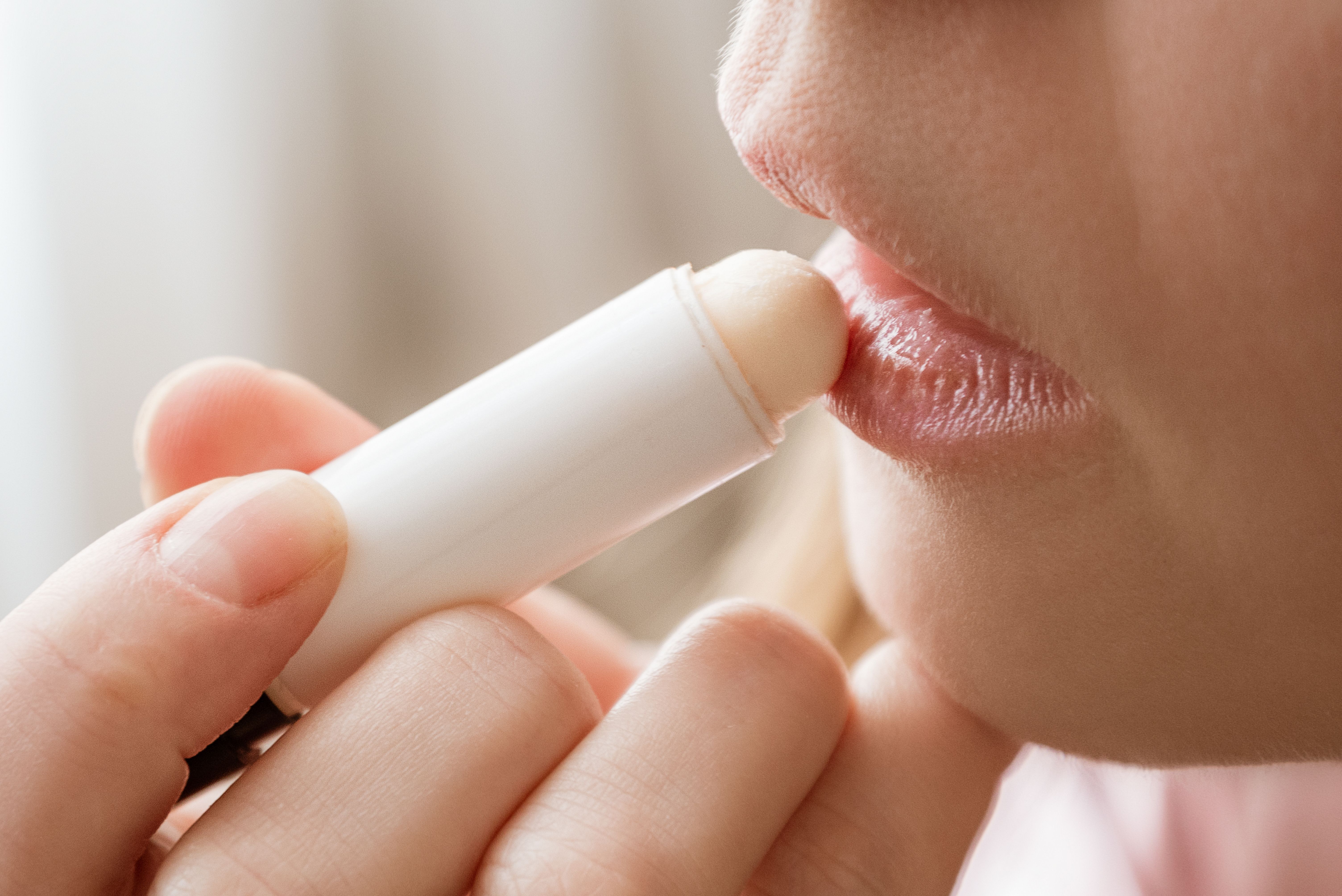 applying lip balm