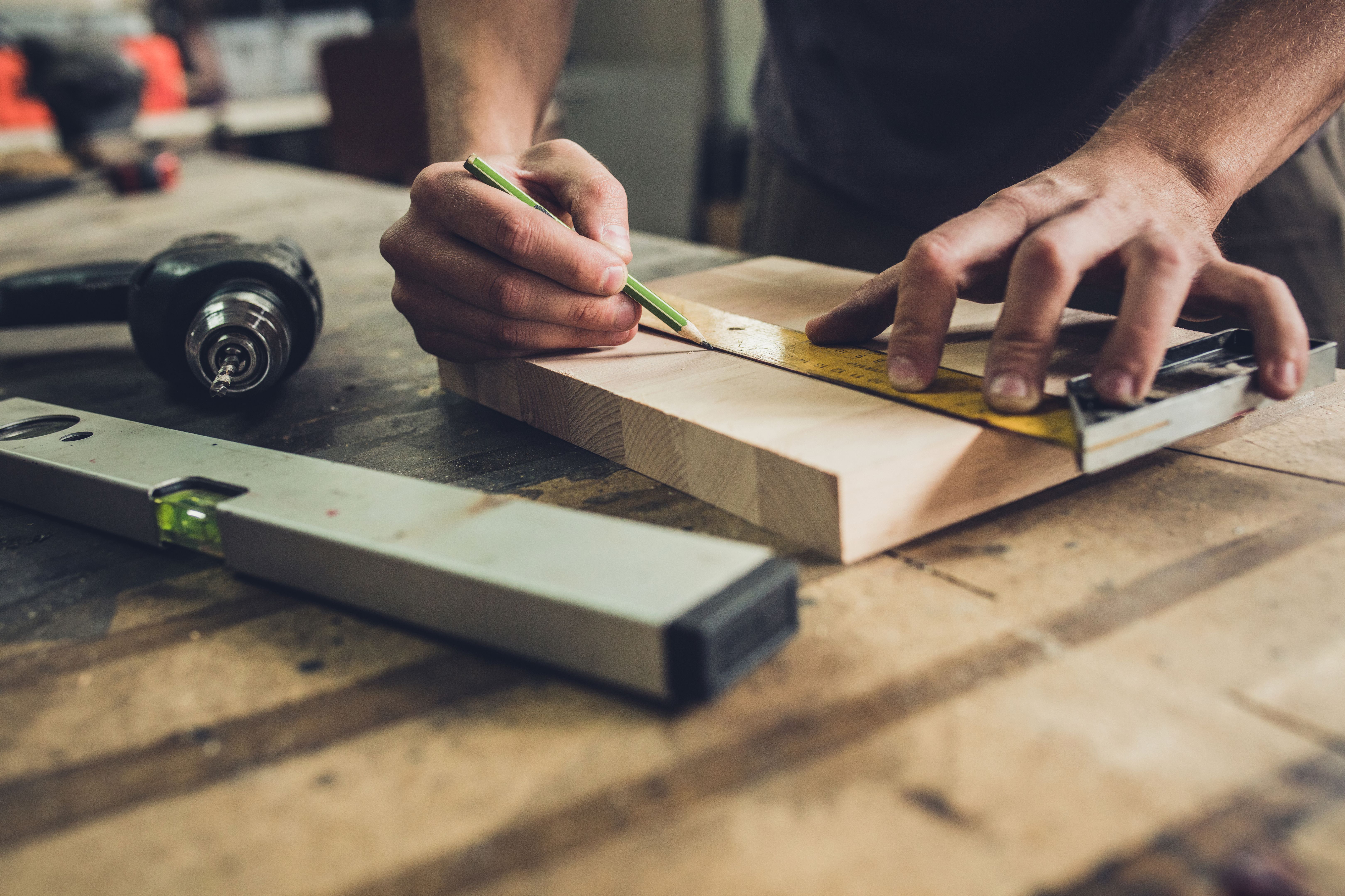 measuring wood planks