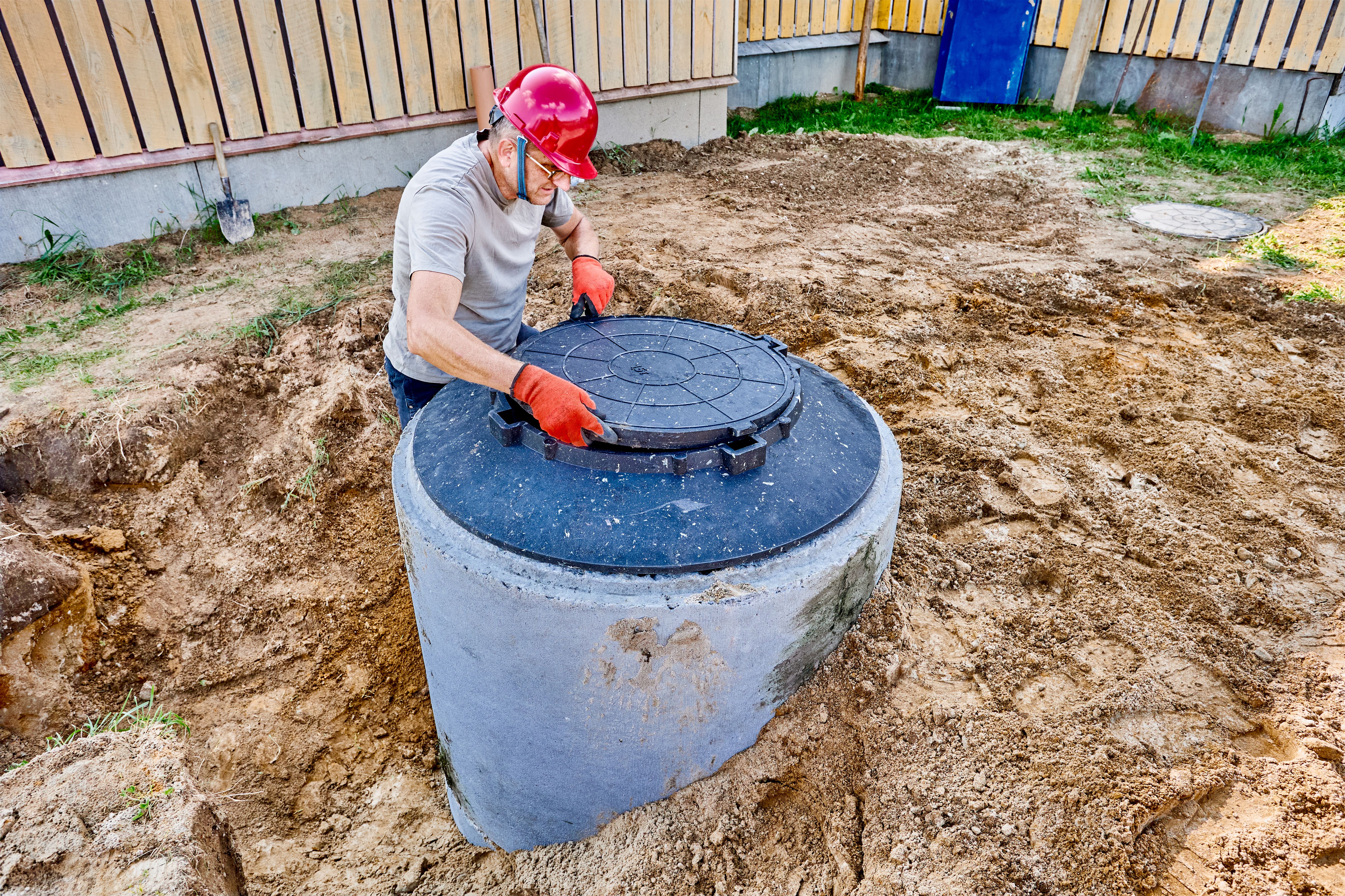 plumber installing sump