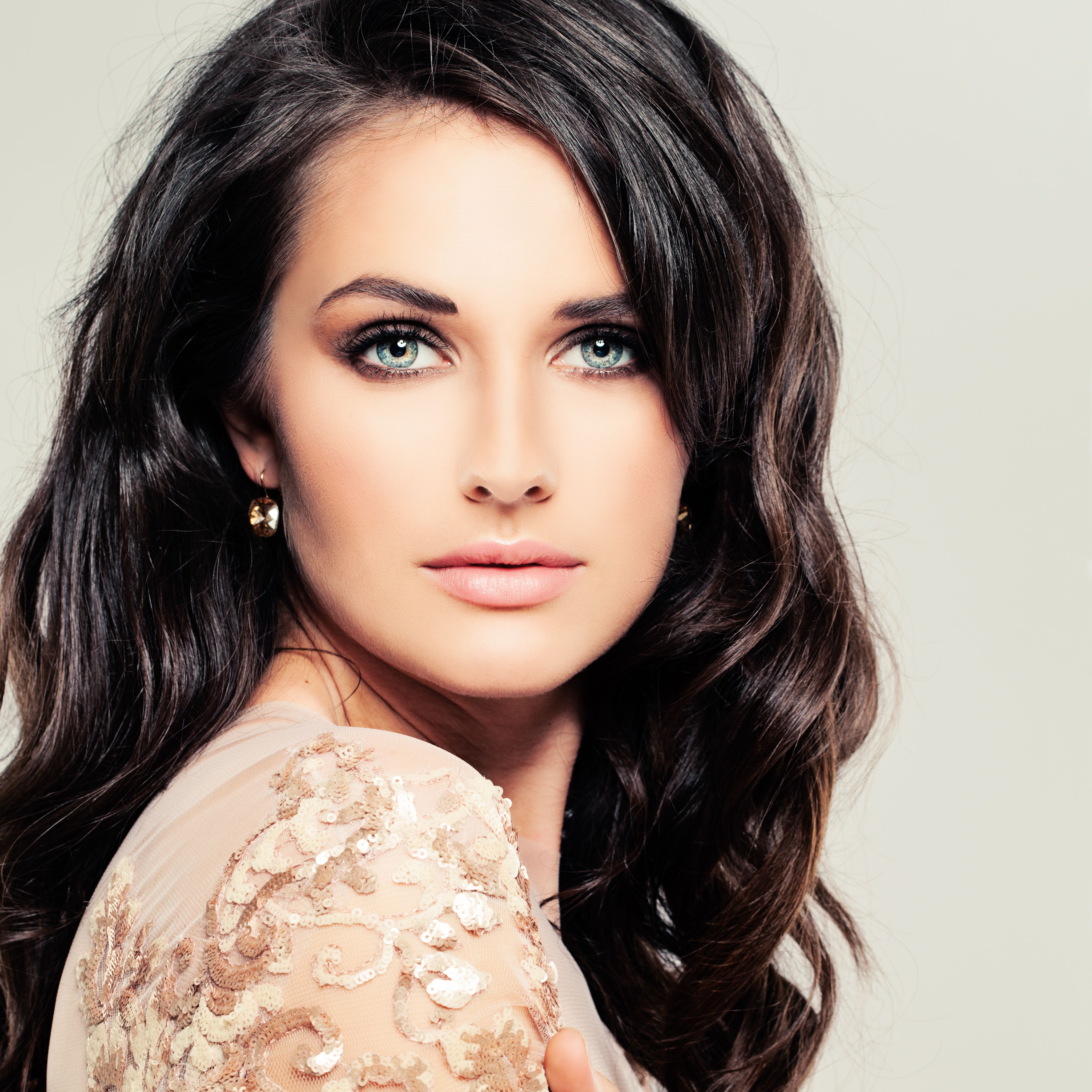 Curly Hair Girl. Young Woman. Makeup and Hairstyle