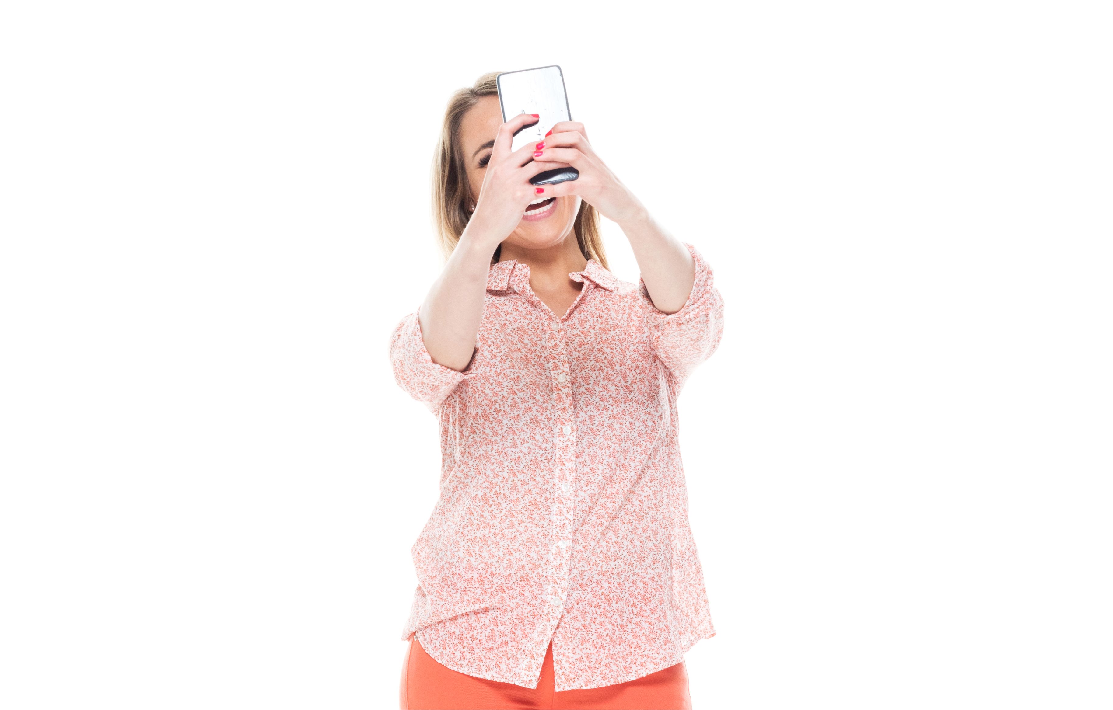 Good looking white female standing on white background - taking a selfie