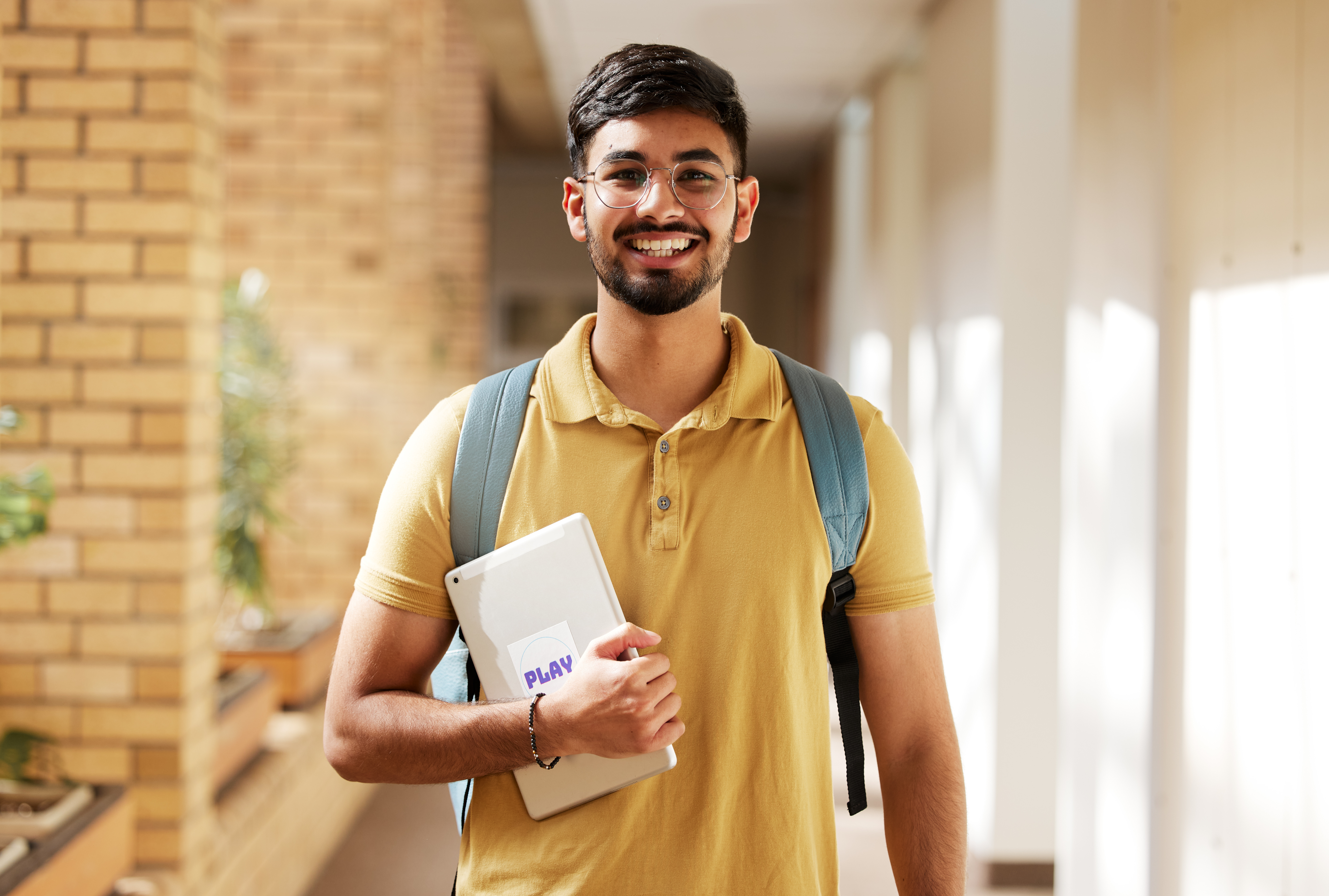 Face portrait, student and man in university ready for back to school learning, goals or targets. Scholarship, education and happy, confident and proud male from India holding tablet for studying. Face portrait, student and man in university ready for back to school learning, goals or targets. Scholarship, education and happy, confident and proud male from India holding tablet for studying.