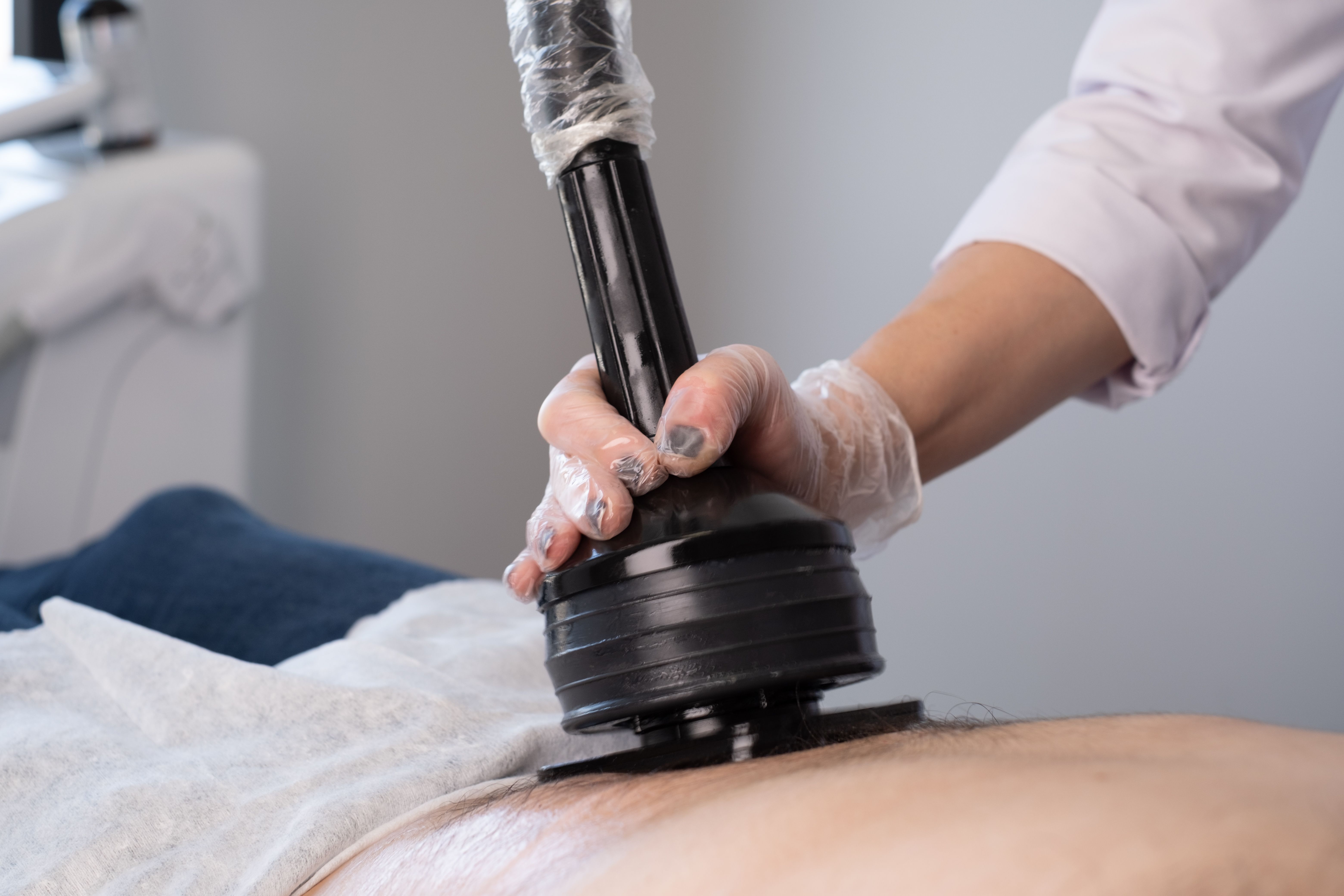 Man having anti cellulite and anti fat therapy cavitation