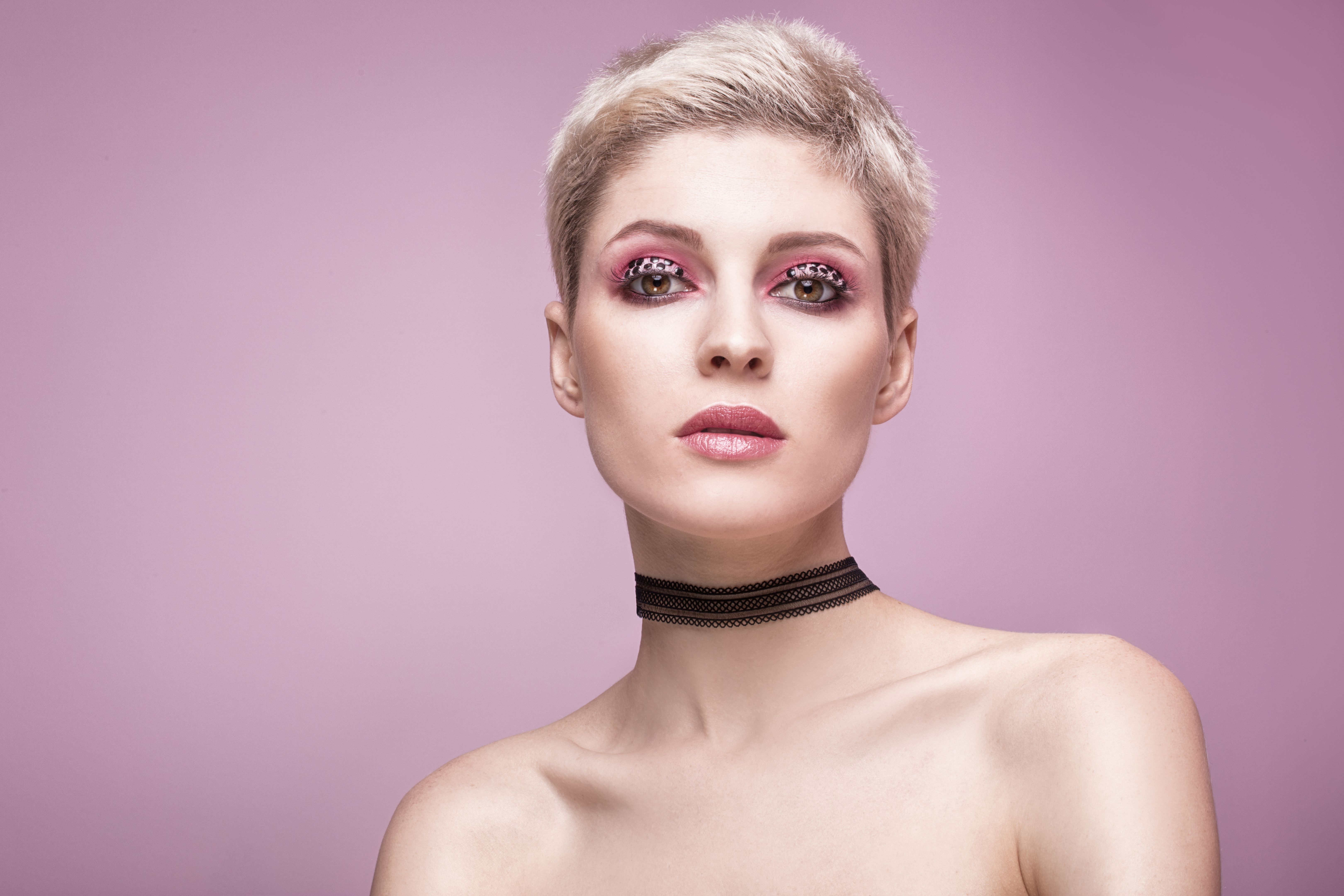 Beauty portrait of blonde woman with artistic makeup.