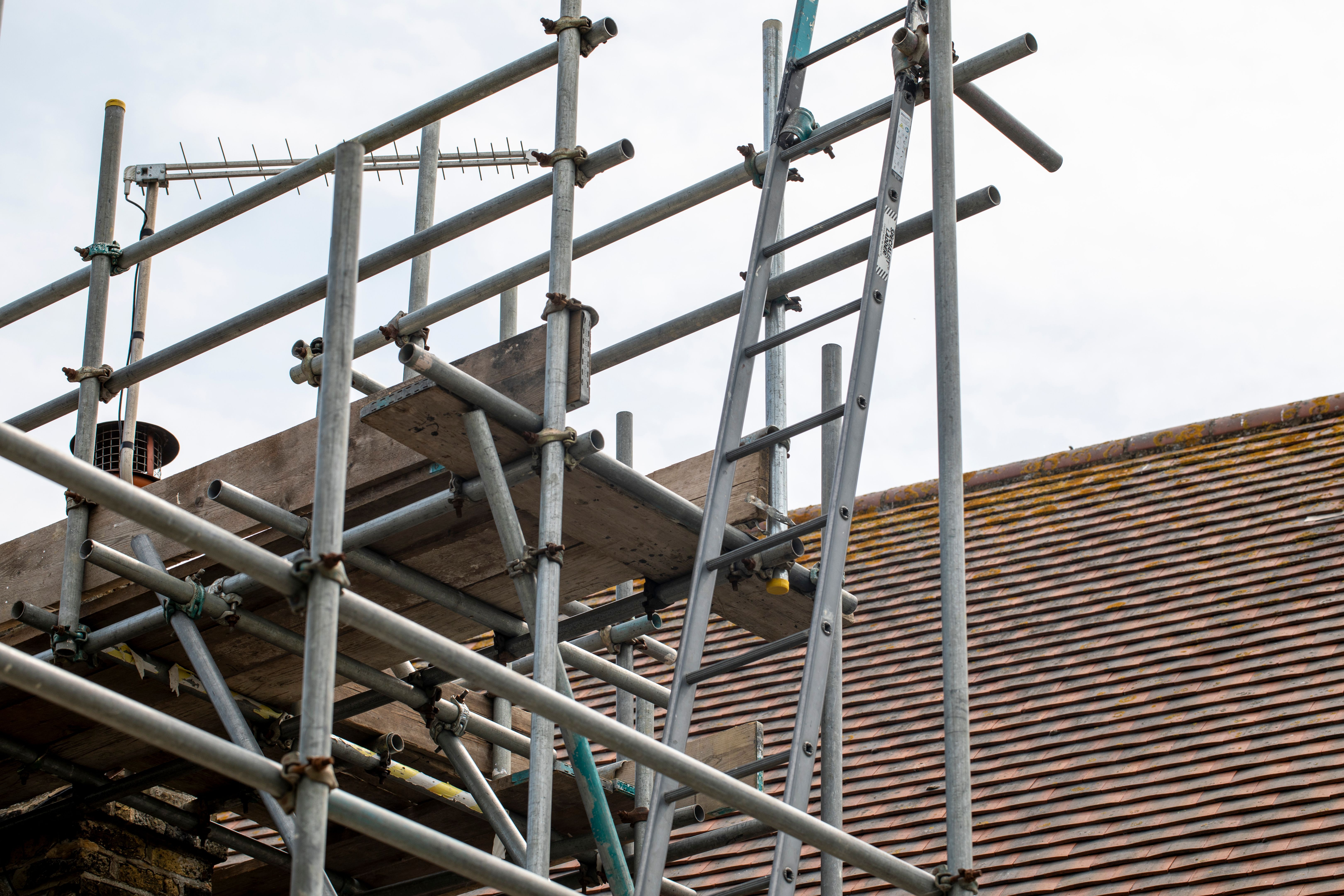 Close-up of scaffolding and a tiled roof