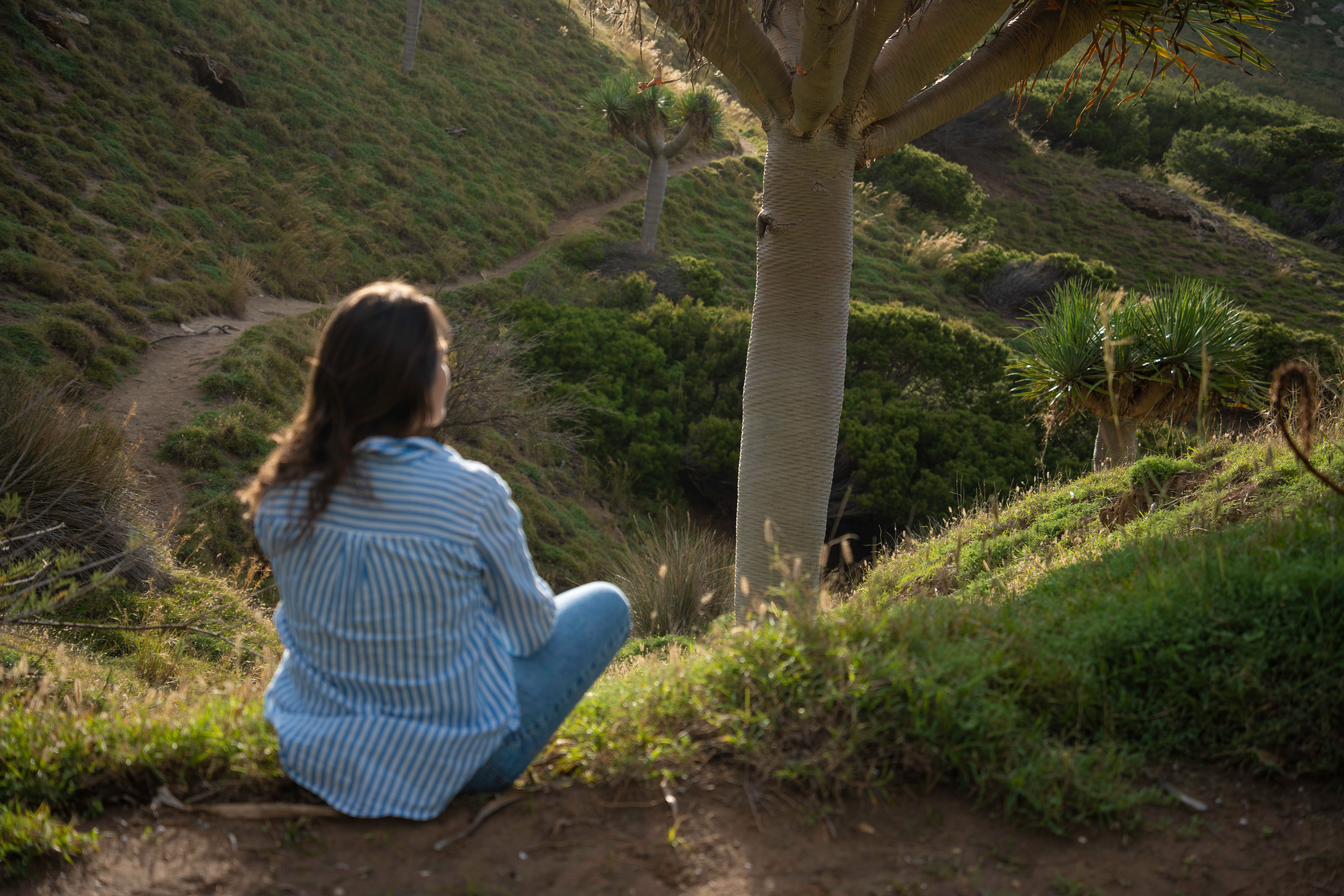 Woman Back to Nature. Morning Among Dragon Trees on Madeira. Woman Back to Nature. Morning Among Dragon Trees on Madeira.