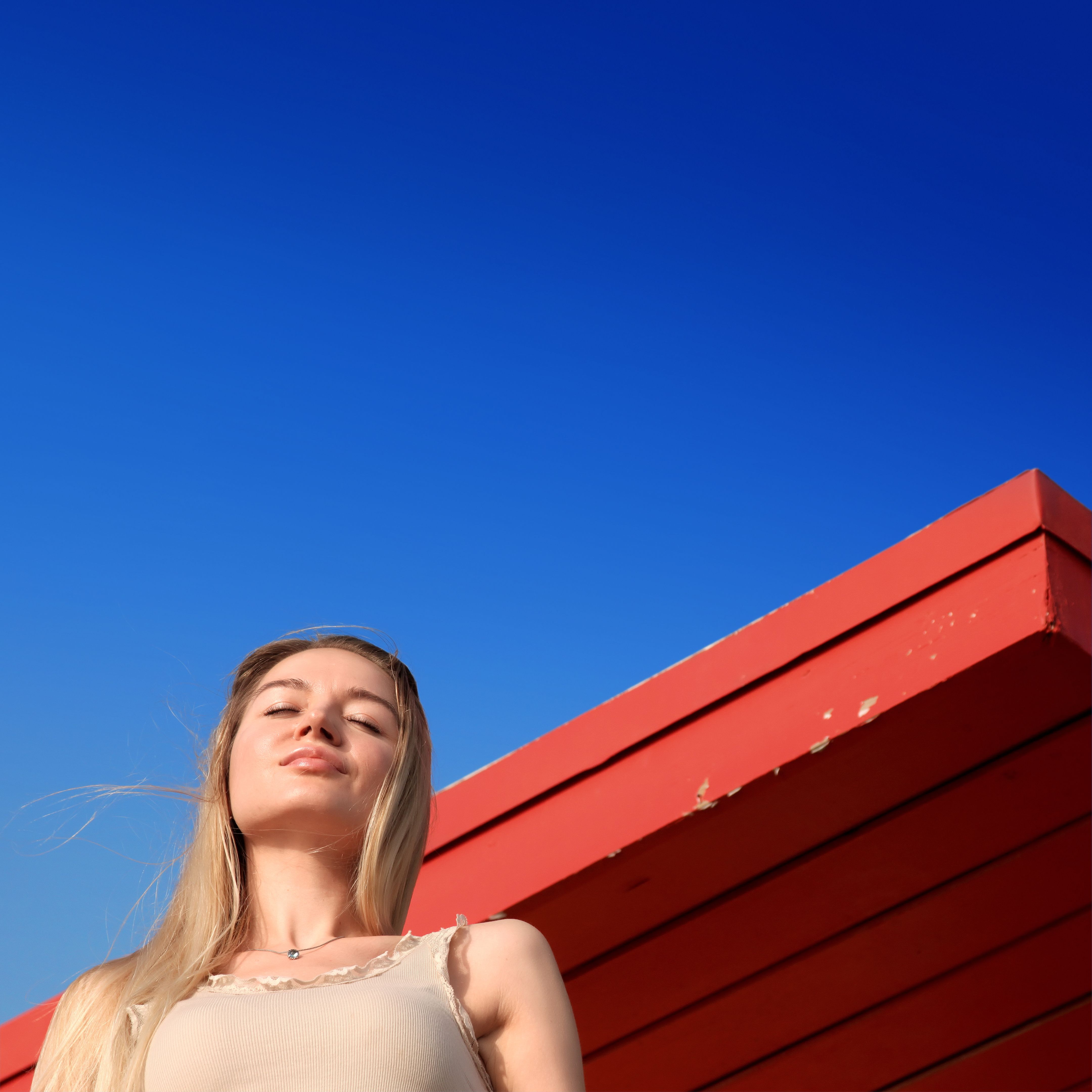 Beautiful happy young blond woman portrait at lifeguard hut Beautiful happy young blond woman portrait at lifeguard hut
