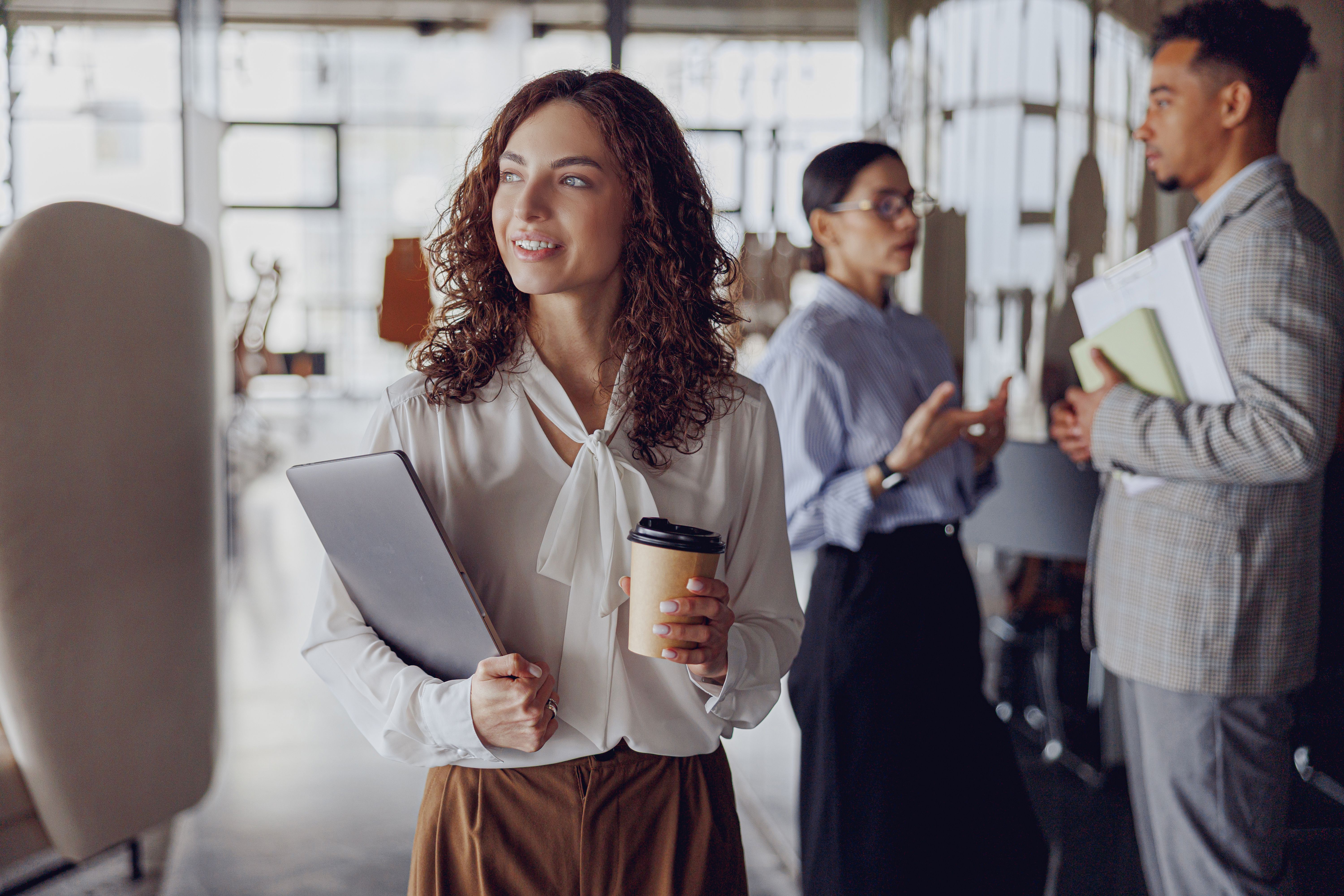Engaging in Professional Networking Activities Within a Modern Office Environment Setting