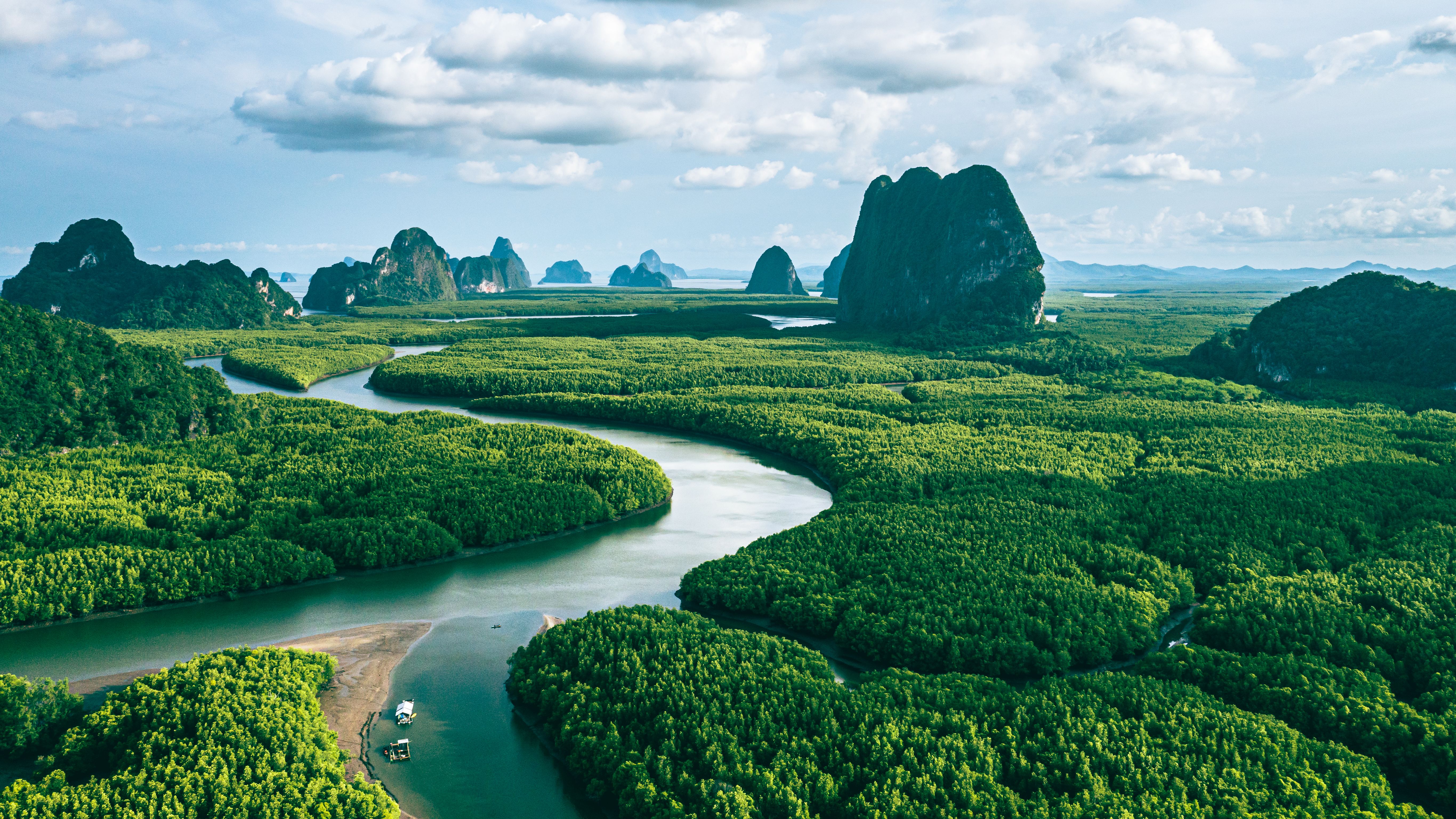 Aerial view of river in the green mangroves forestand and limestone hill in Phang nga bay, Thailand. Aerial view of river in the green mangroves forestand and limestone hill in Phang nga bay, Thailand.