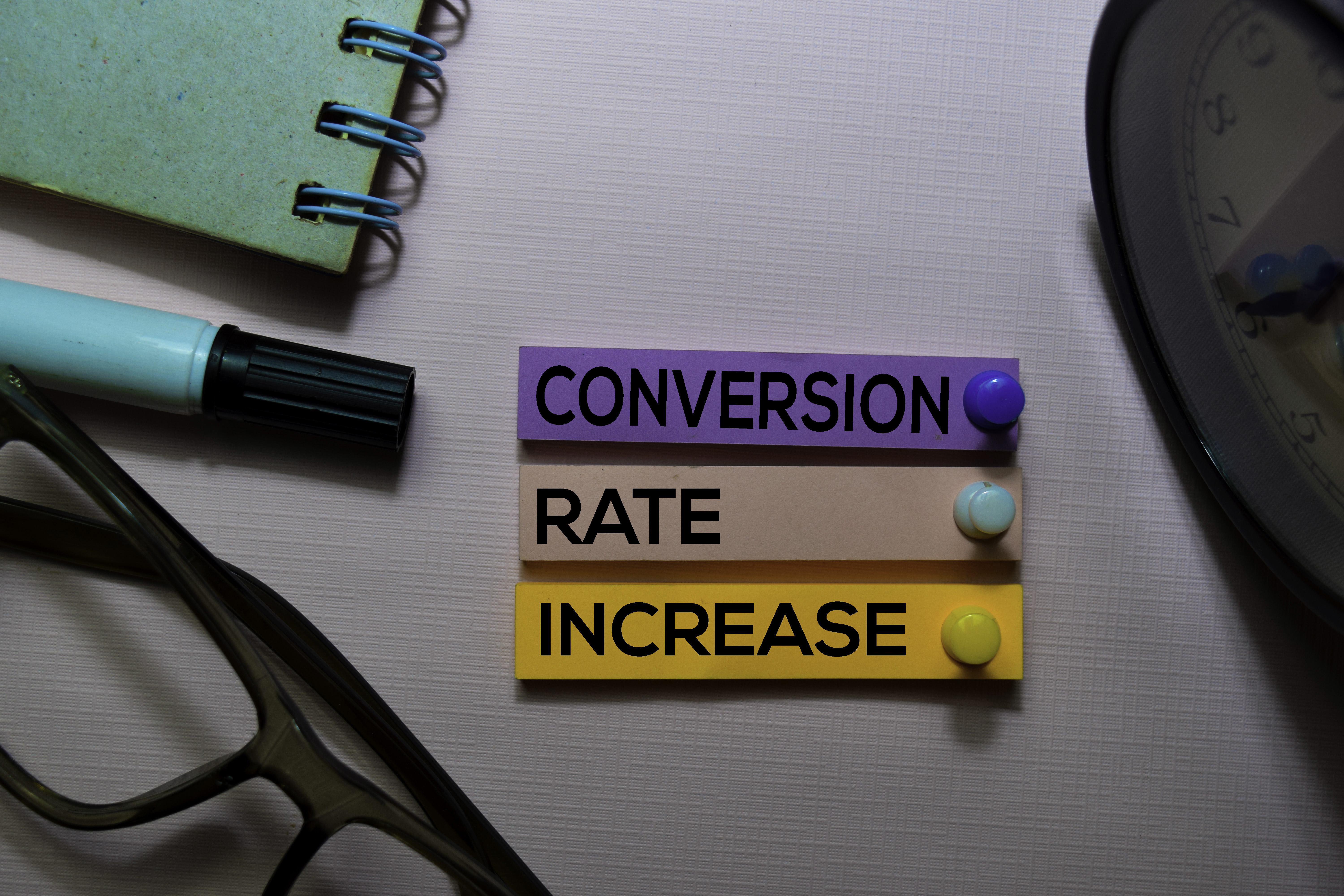 Conversion Rate Increase (CRI) text on sticky notes isolated on office desk
