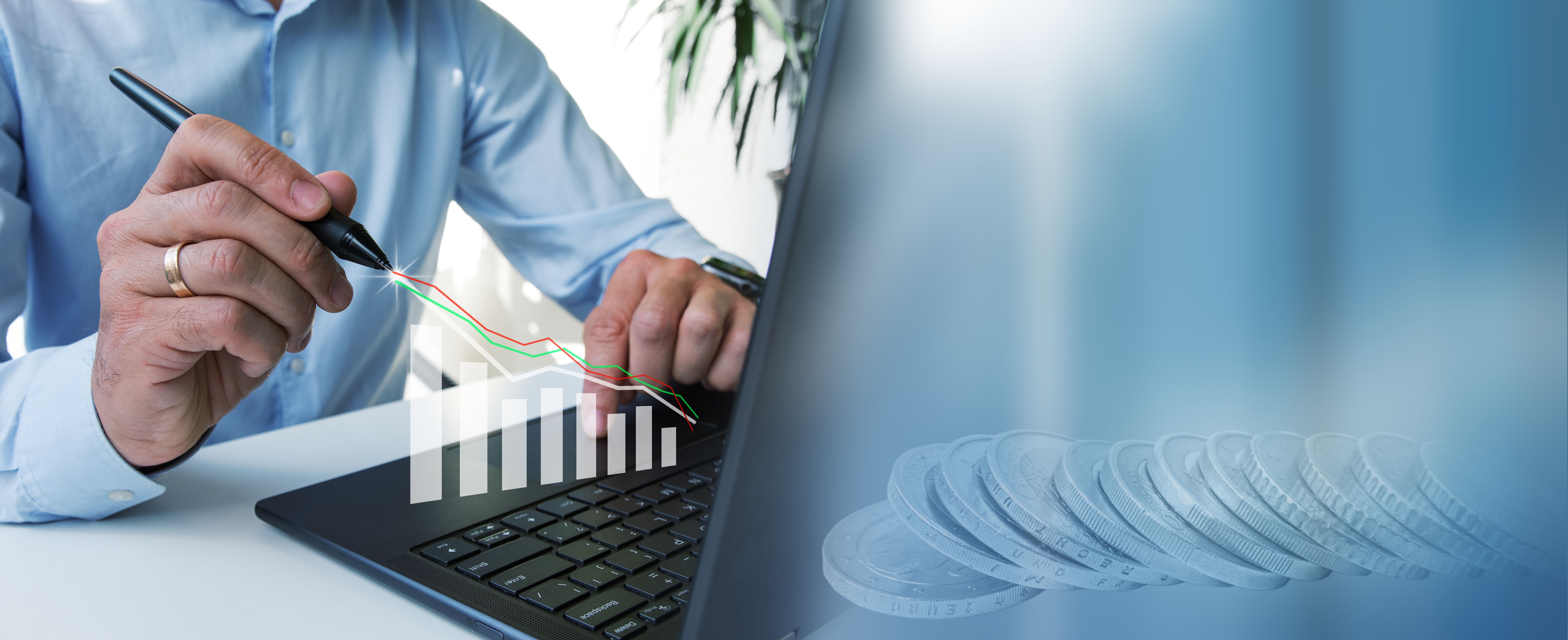 The businessman is working on a laptop,studying the growth chart. Business financial plan market concept, performance of profit growth.