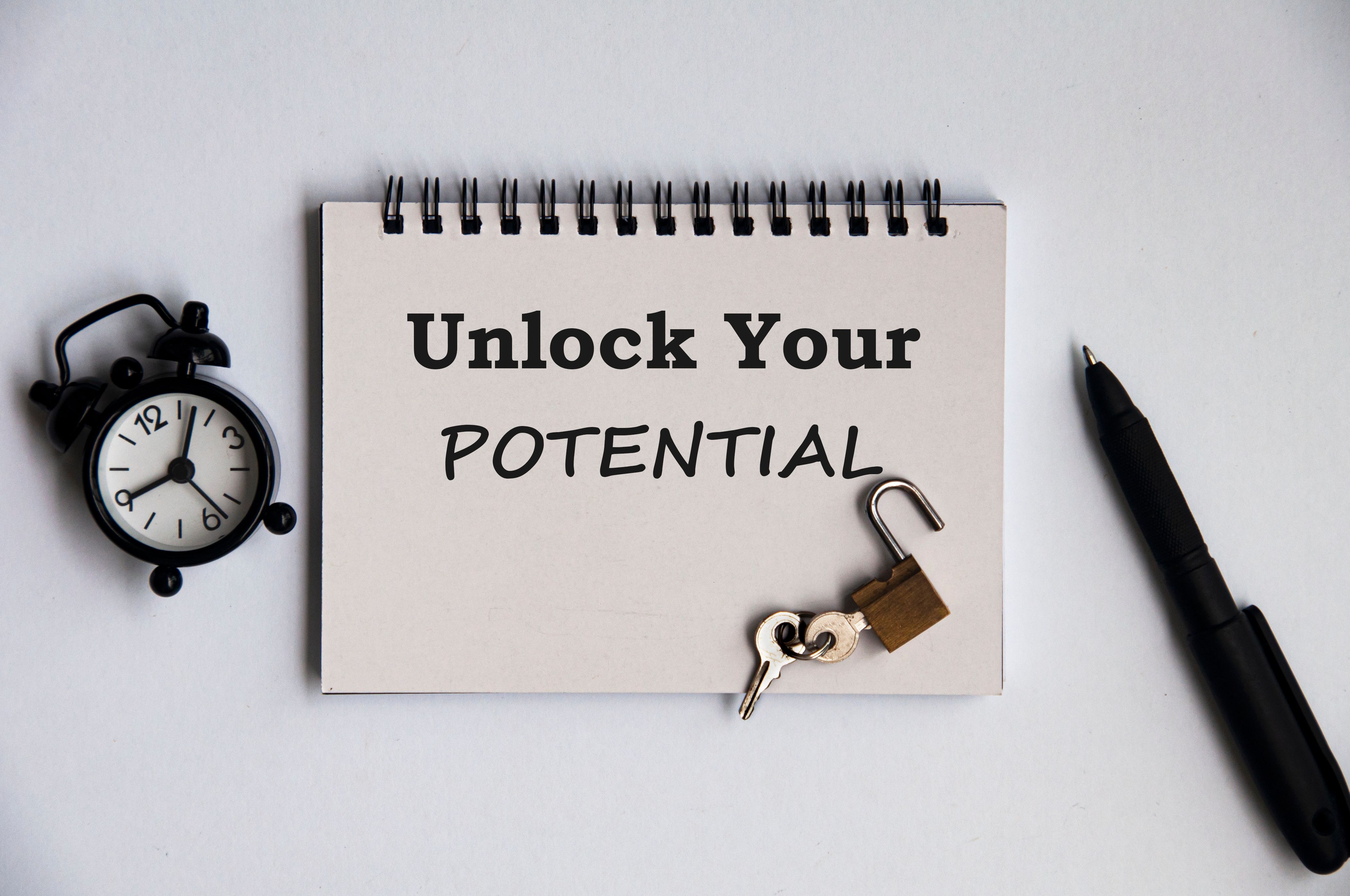 Motivational quote notepad - Unlock your potential. Motivational concept Motivational quote notepad - Unlock your potential. Motivational concept