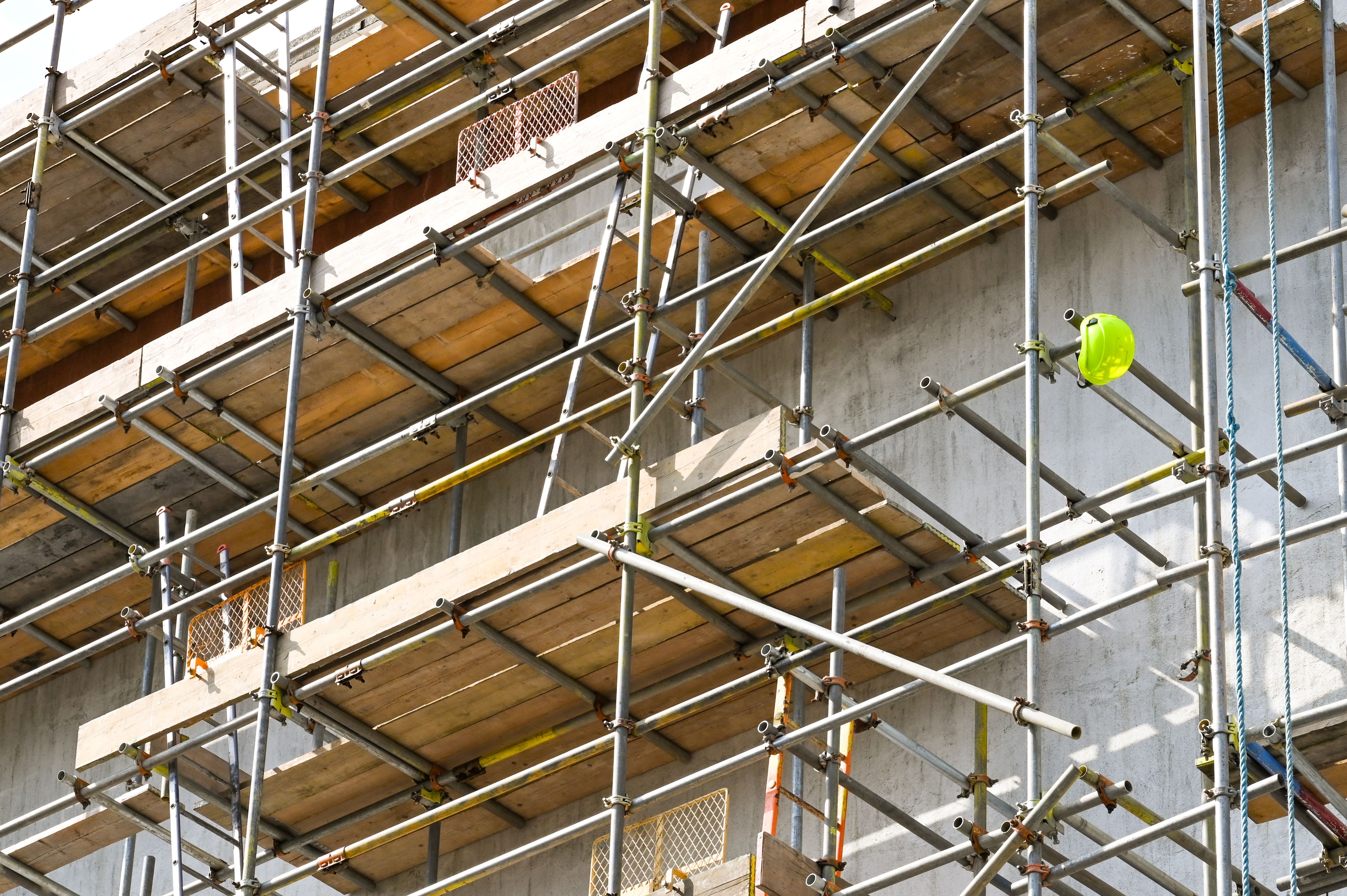 Safety helmet hanging from scaffolding