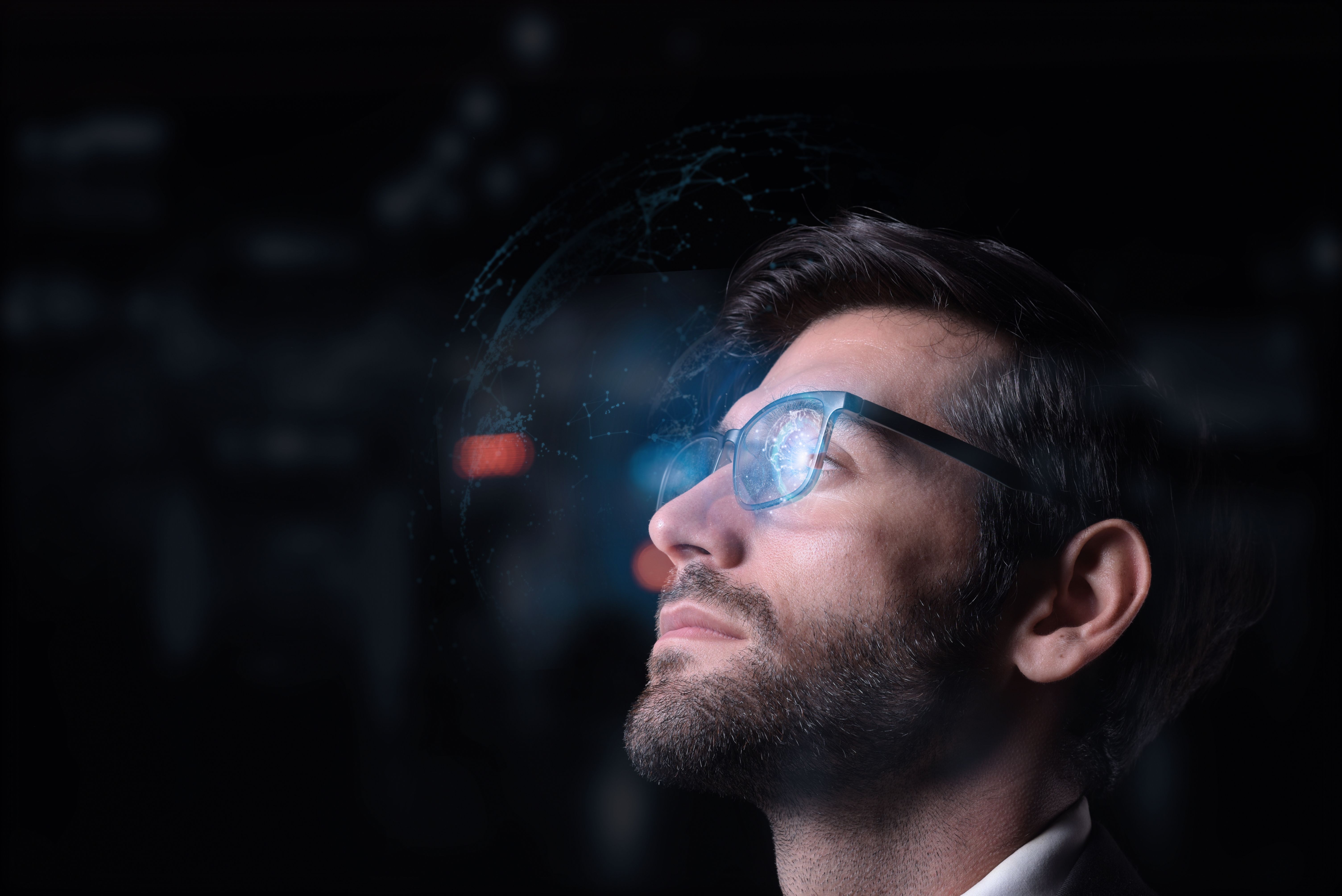 Working on a computer, a focused developer looks at programming code, data, cyber security, and digital technology while wearing glasses and producing software. Working on a computer, a focused developer looks at programming code, data, cyber security, and digital technology while wearing glasses and producing software.