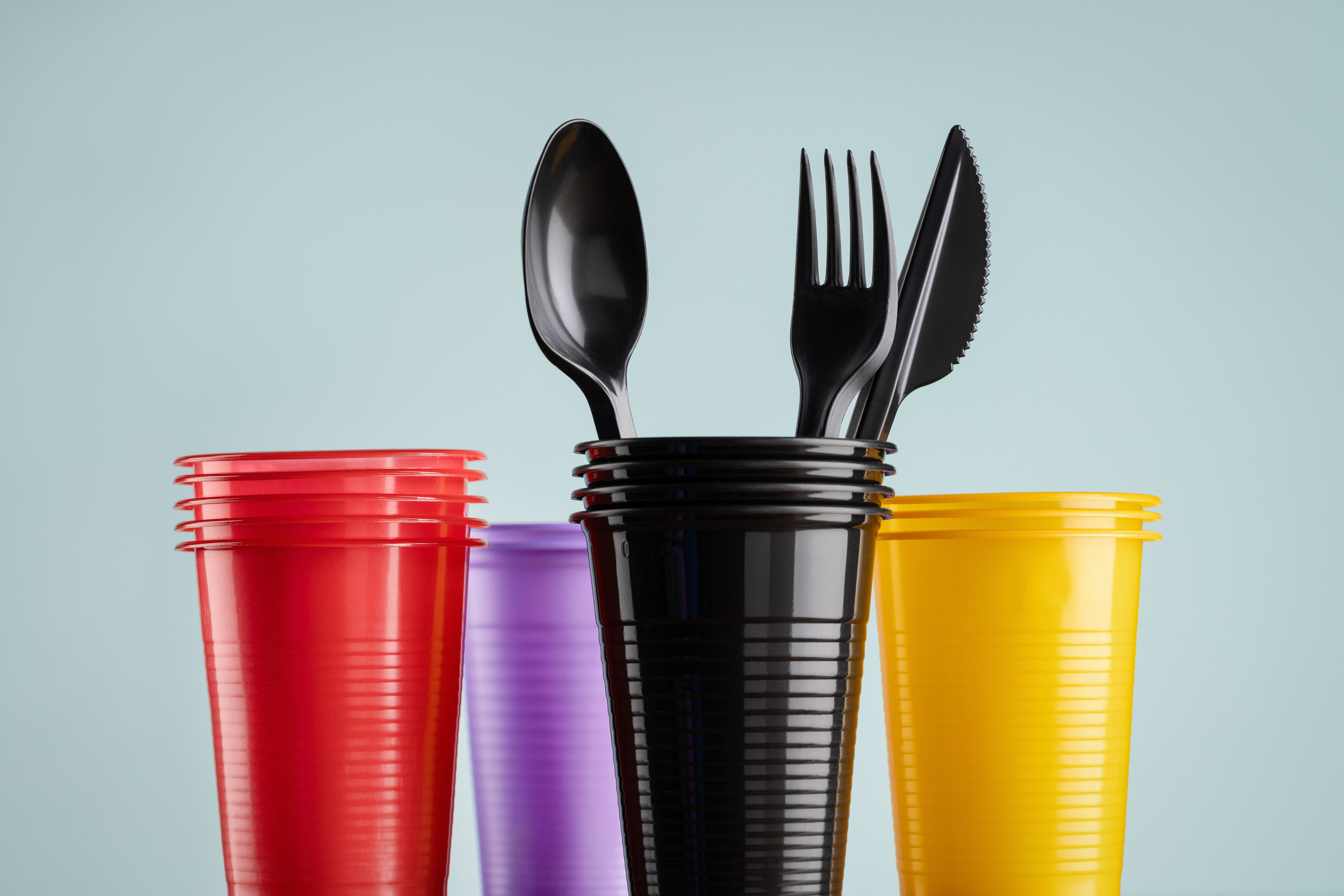 Disposable colored plastic tableware.