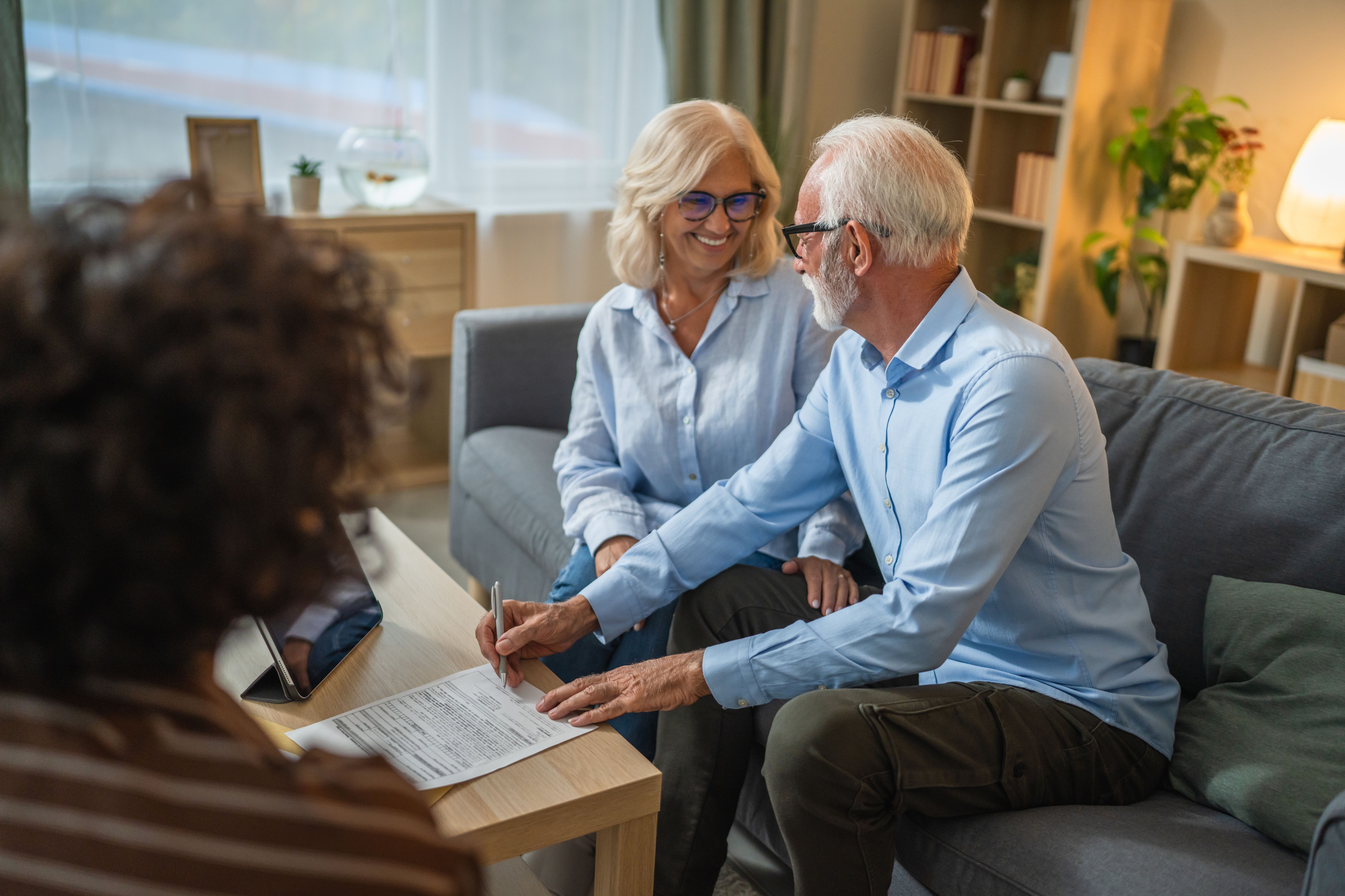 couple signing documents