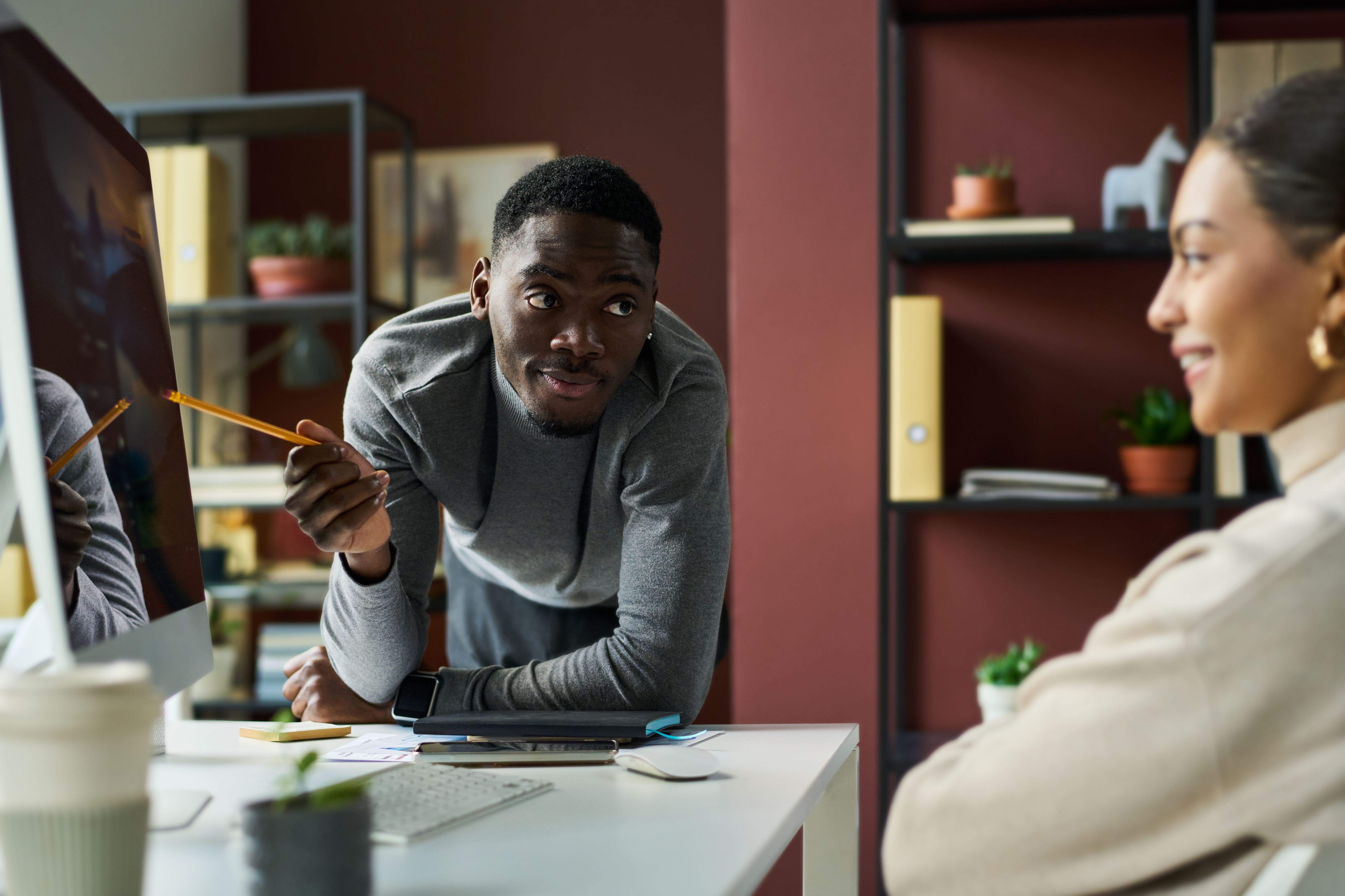 Businessman pointing at computer screen