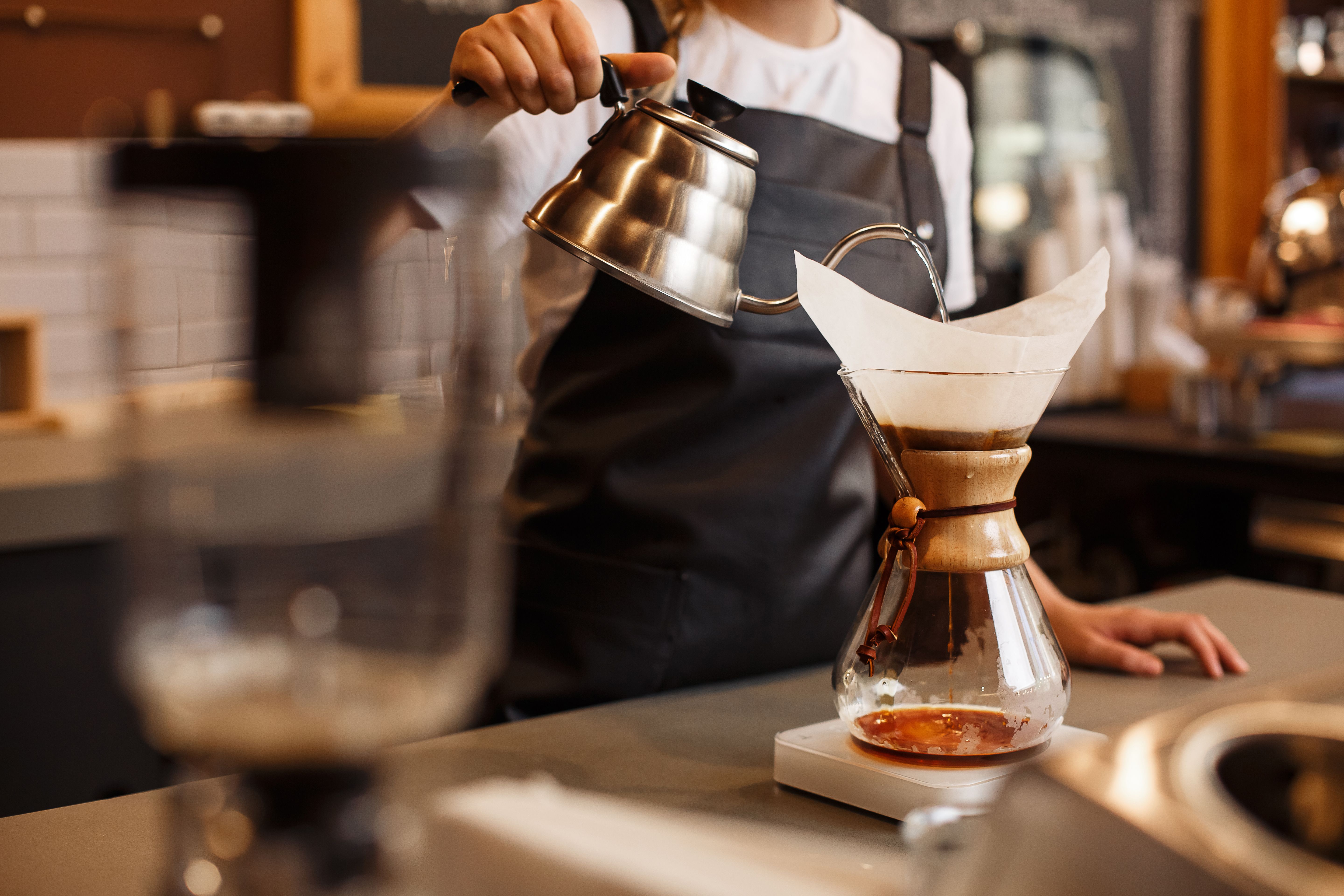 barista brewing coffee