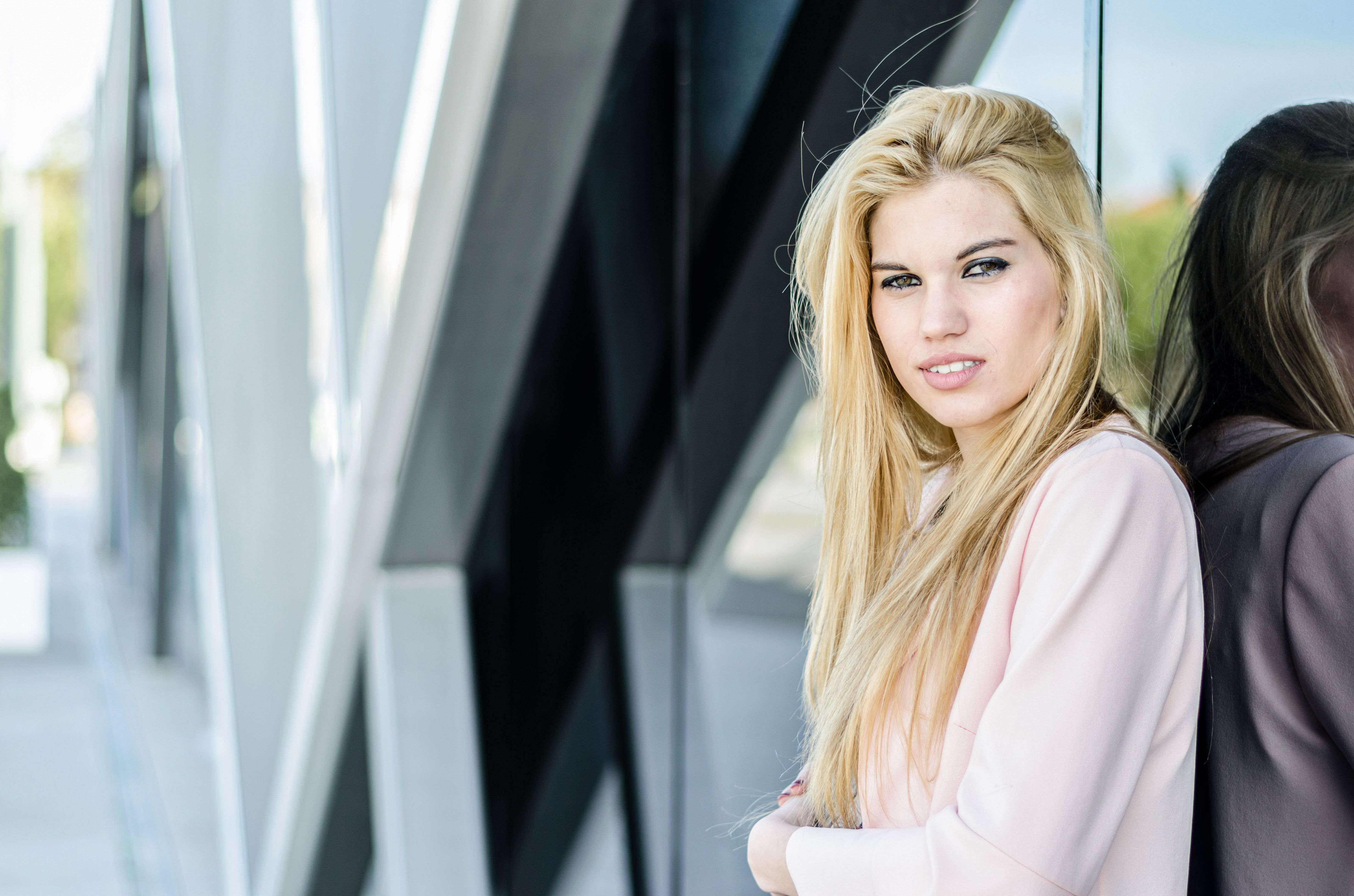 happy blonde young woman looking at camera happy blonde young woman looking at camera