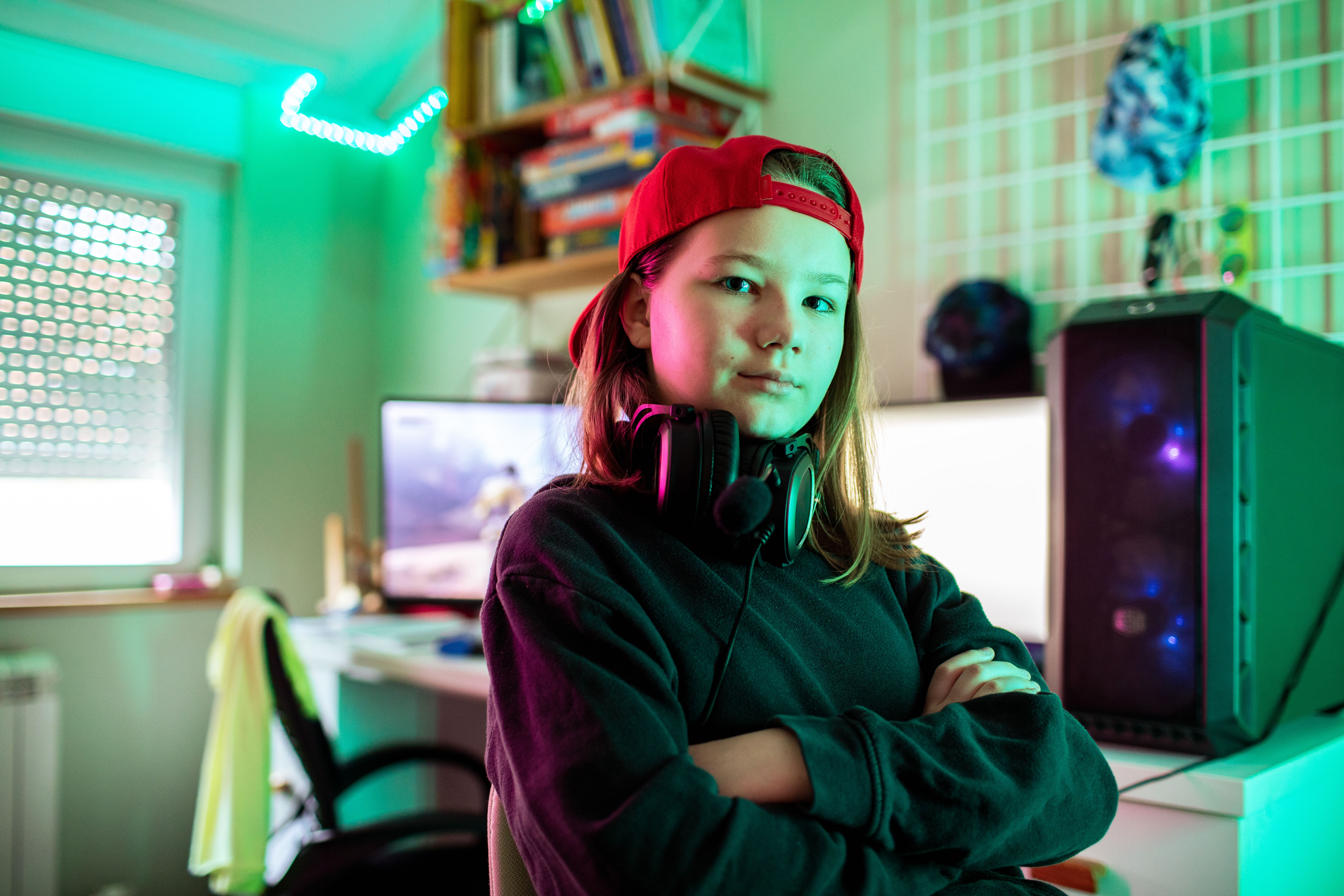 Portrait of a girl gamer in her bedroom