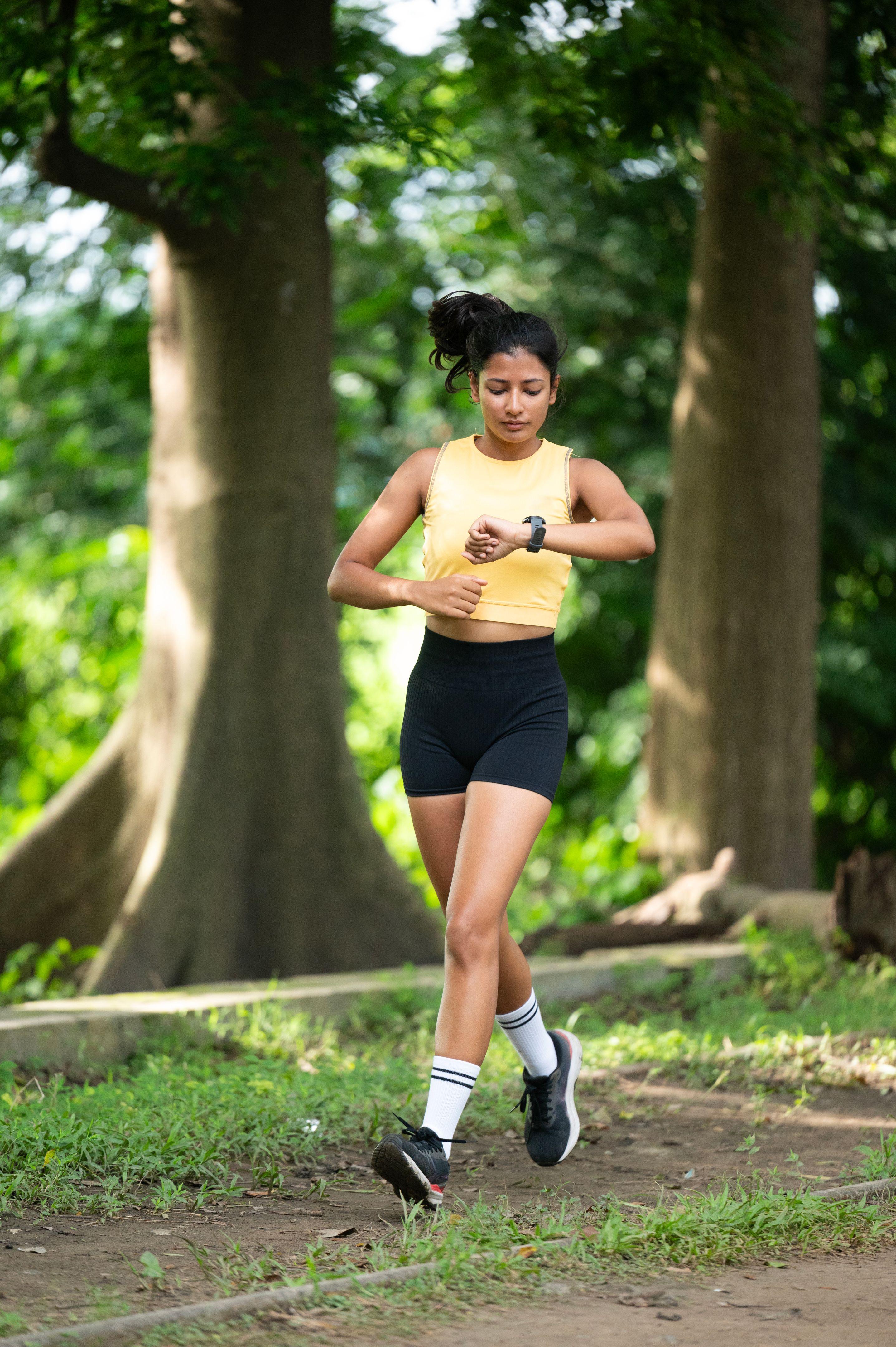 Female runner checking info on smart watch