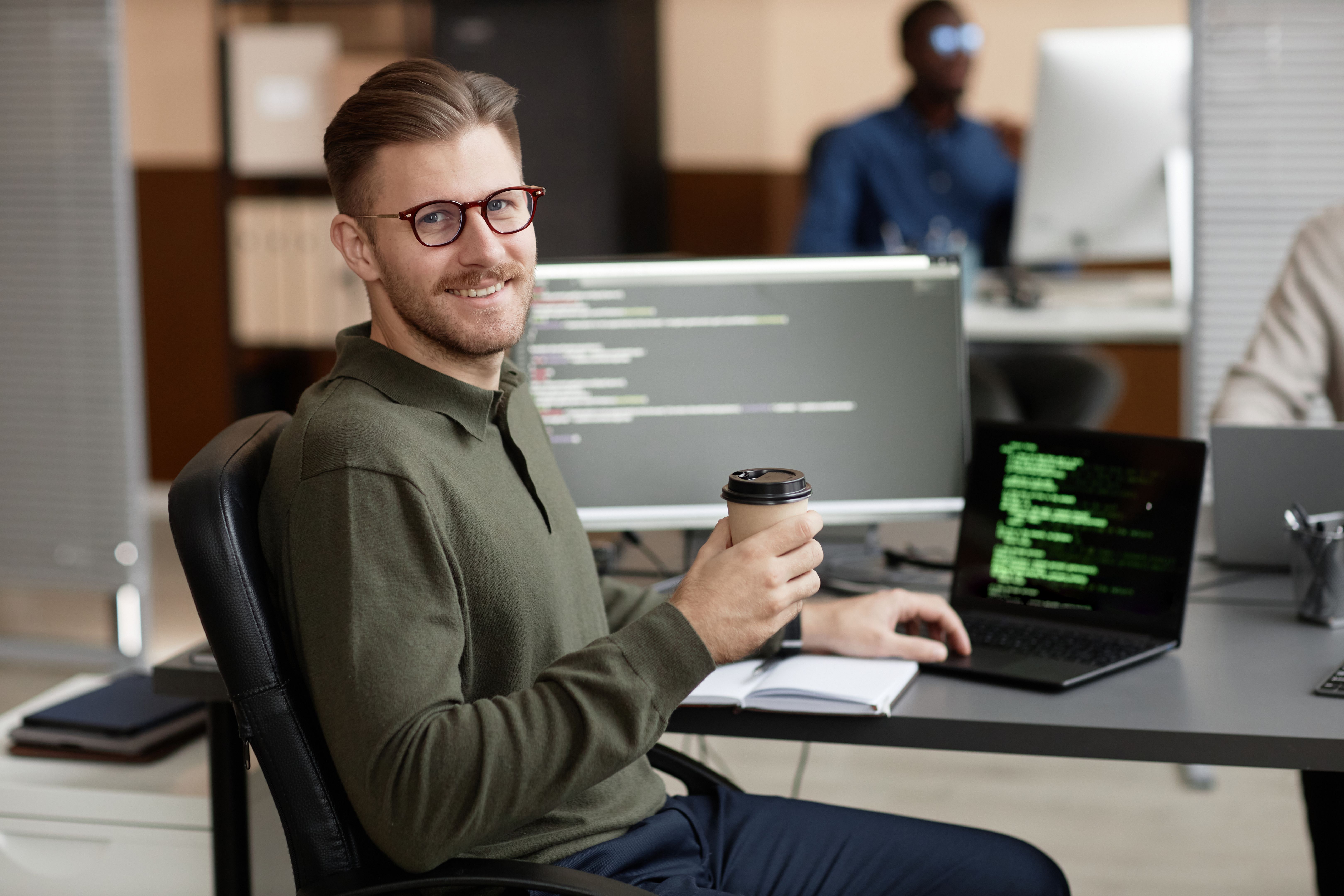 Portrait of Cheerful IT Professional in Office