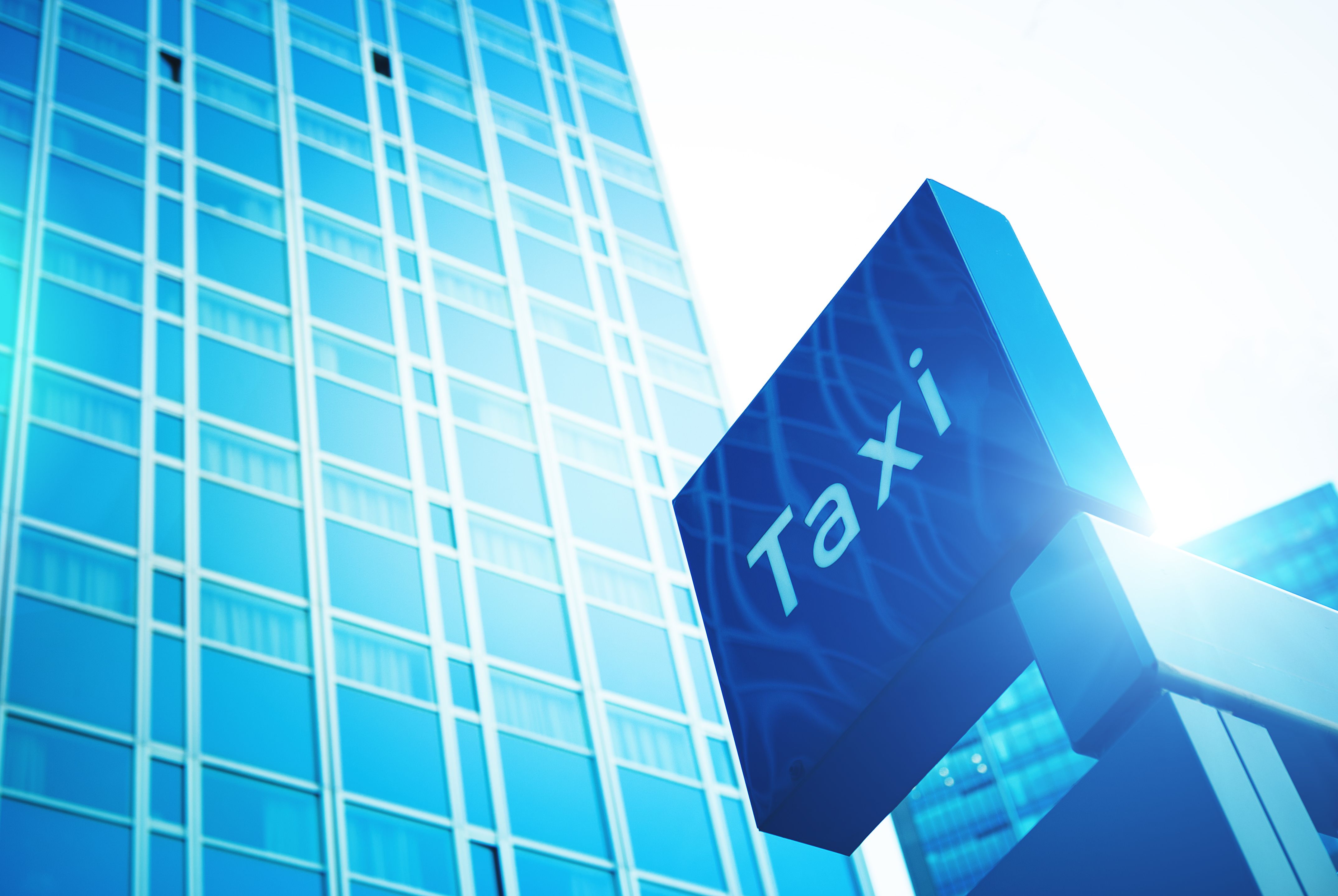 Contemporary building exterior with taxi sign Contemporary building exterior with taxi sign