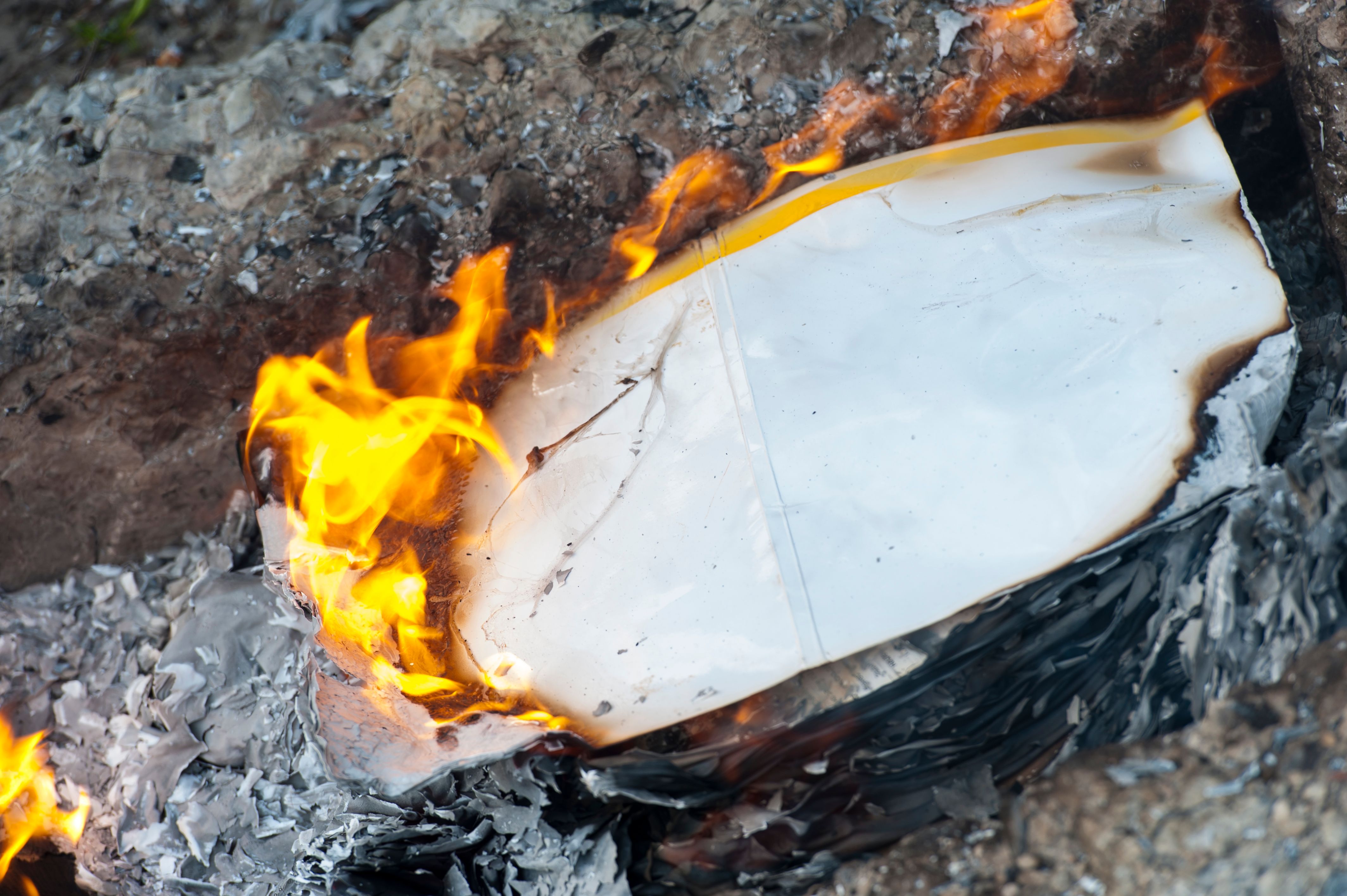 Burning office white paper in bonfire