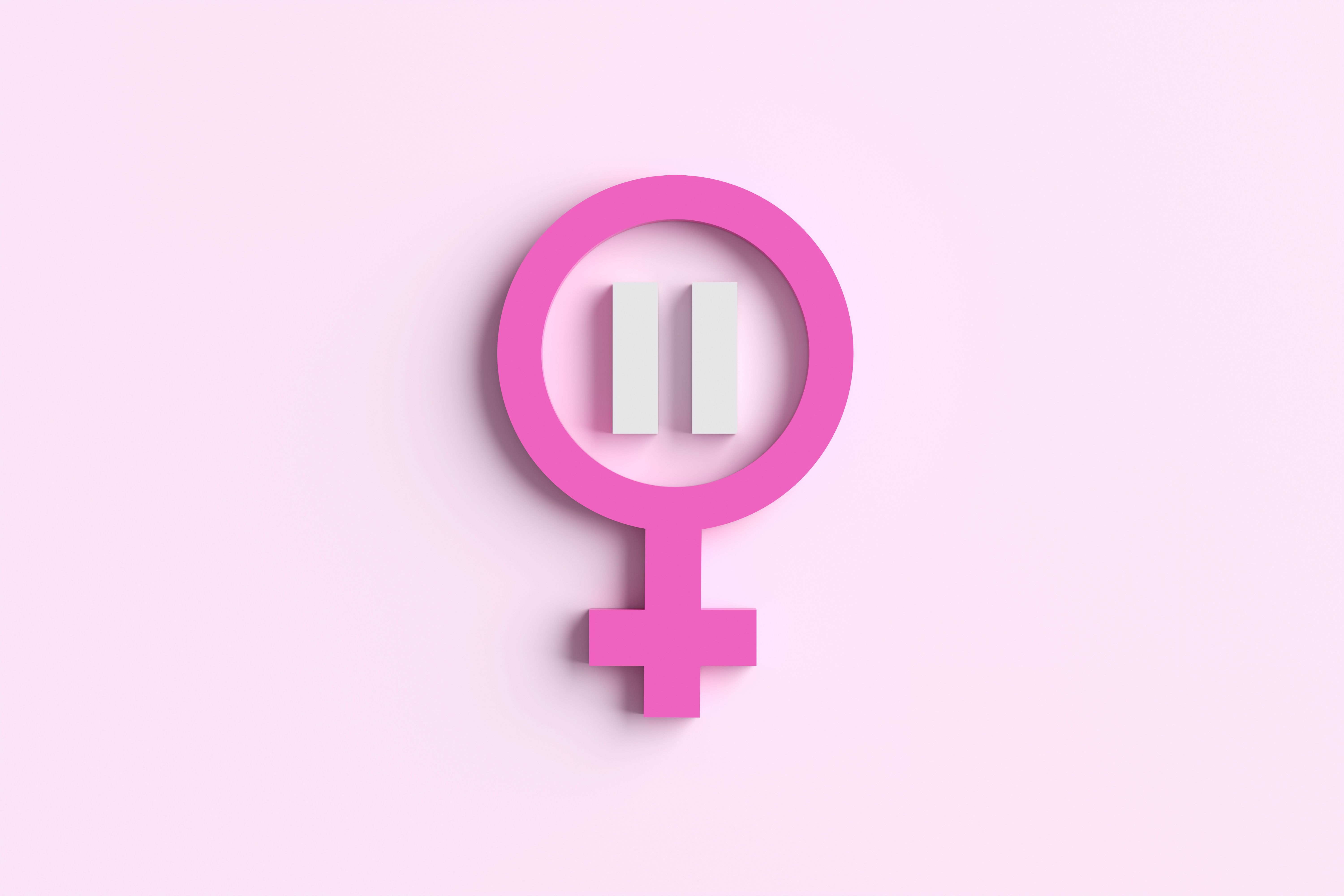 Pink female gender symbol with pause sign on pink background